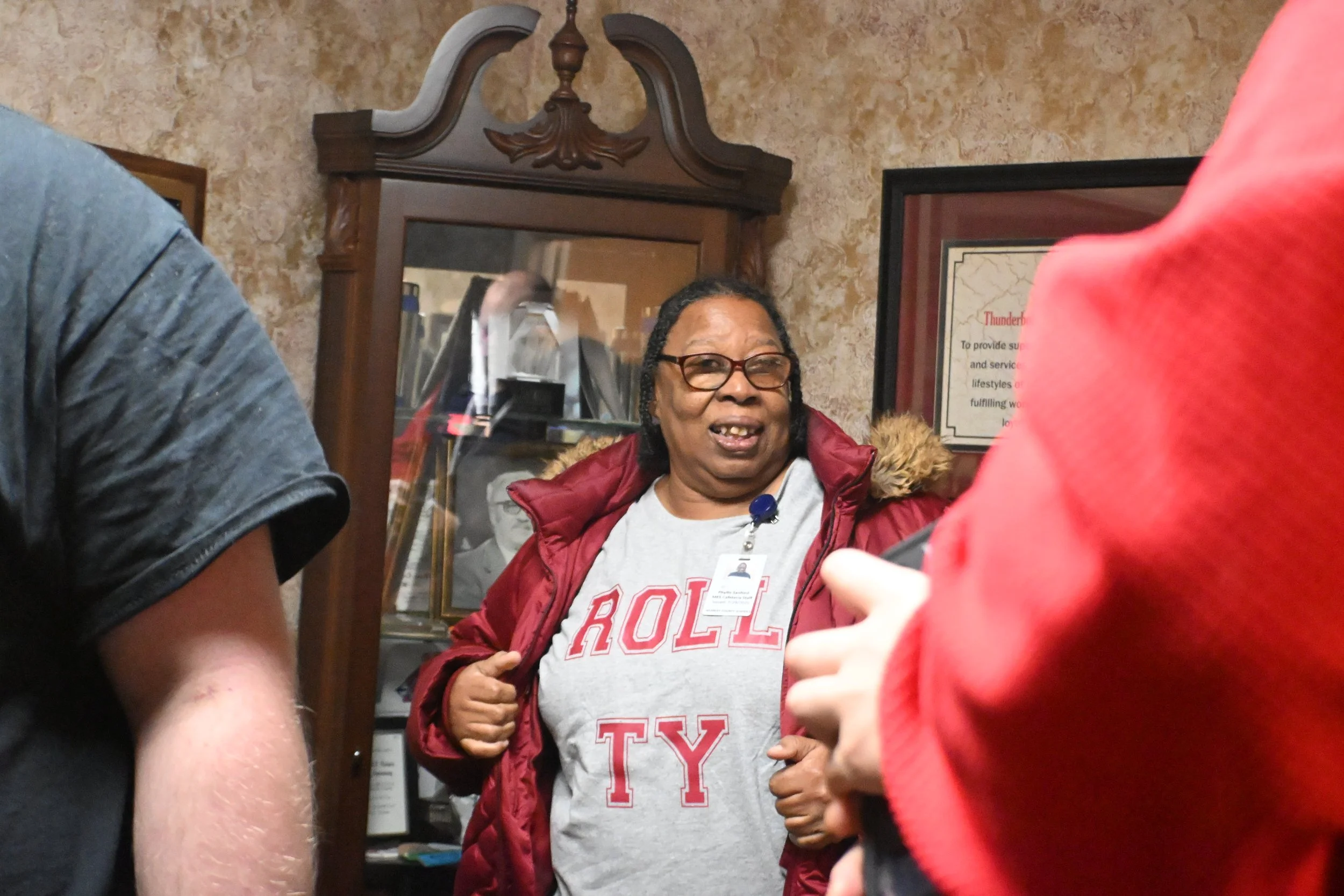A woman we support in the lobby area, waiting for her turn to go the air during the SJCS Radiothon