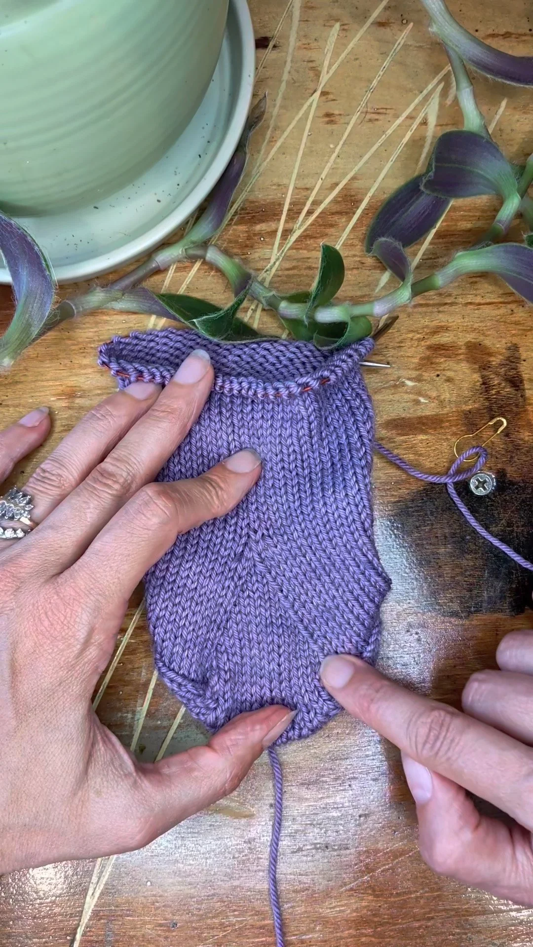 A knit sock showcases the result of knitting k1tbl over an ssk.