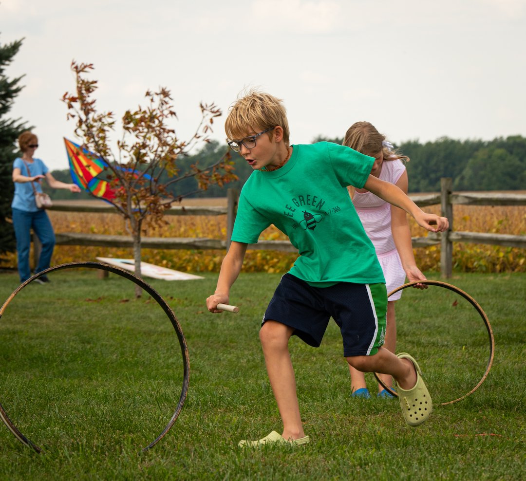  Rolling the hoops in the school yard 