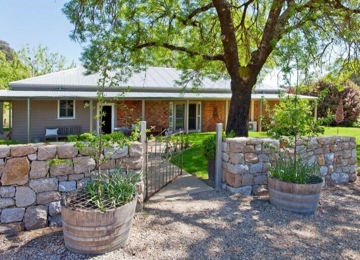  The charming country cottage with the original 1860’s brick home and extension added by previous owners 