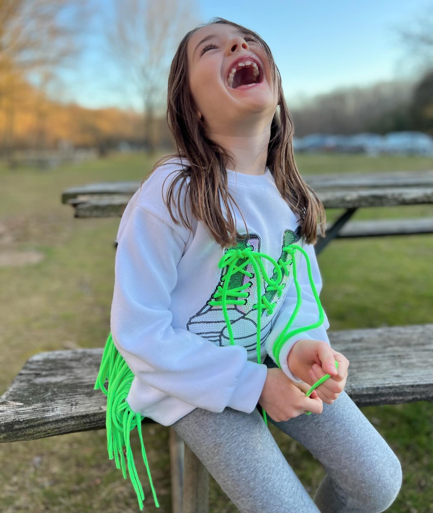 Step Up Your Style: This neon green sweatshirt features a unique sneaker sequin patch, designed not just for flair but to teach the essential skill of tying. Bright, fun, and educational, it&rsquo;s the perfect blend of fashion and learning!!! 💚💚💚