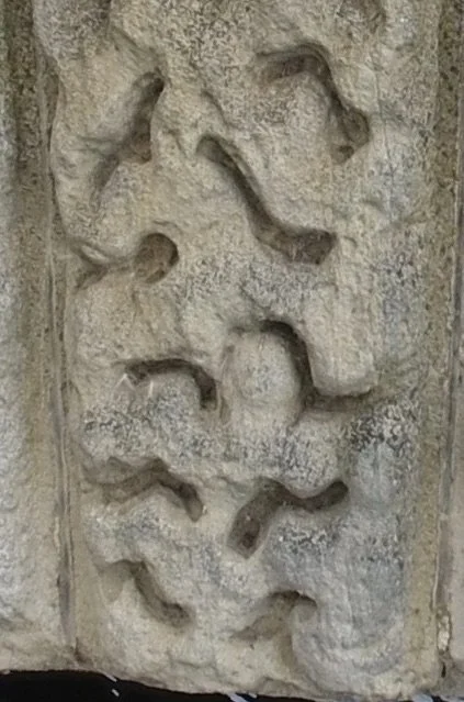 South face, west arch 9th voussoir, L