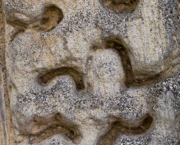 South face, west arch 9th voussoir, L