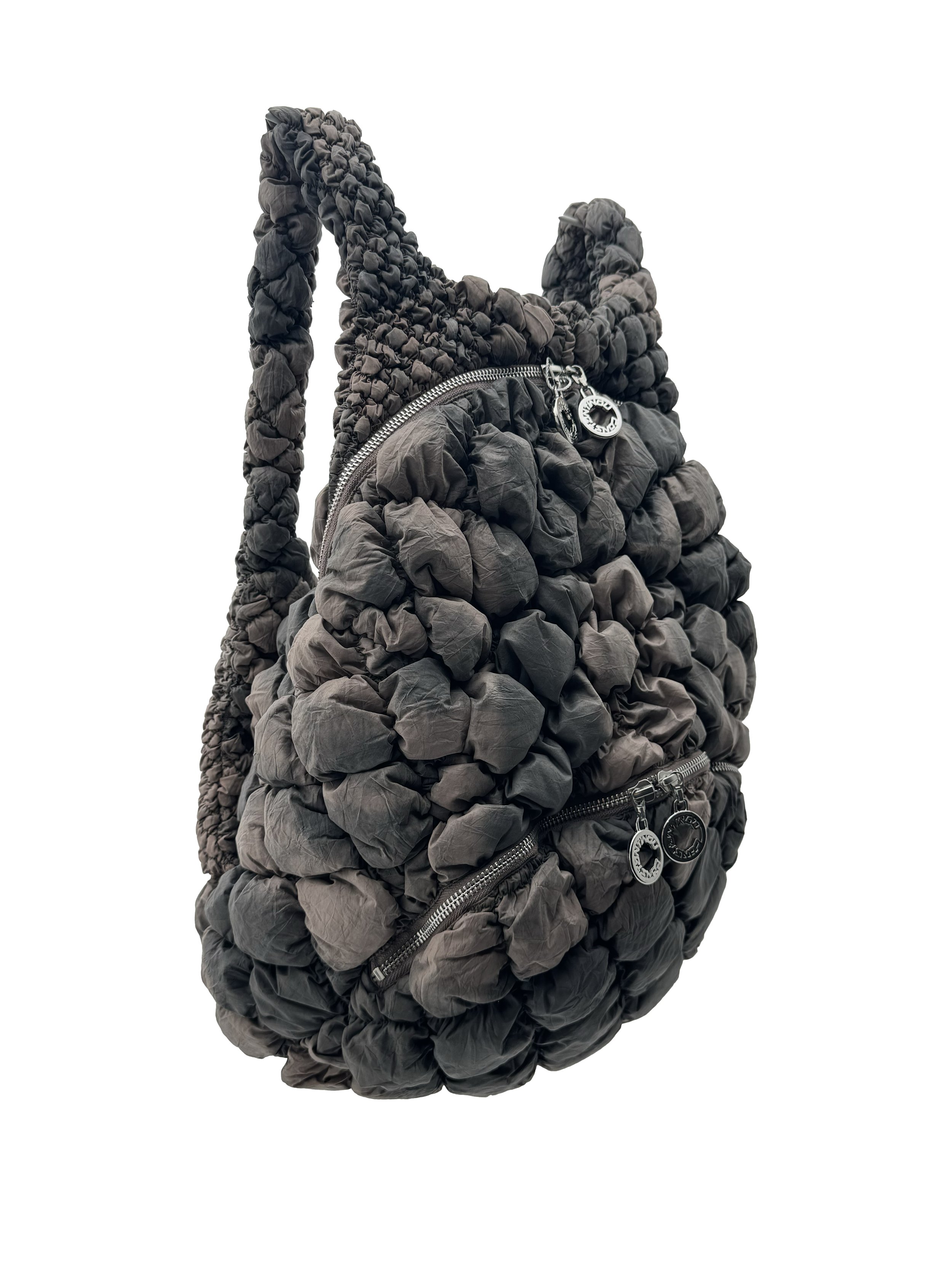 backpack brown side.jpg
