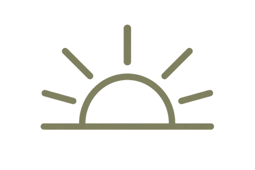 Sunset or sunrise with a semicircular horizon and rays extending outward.