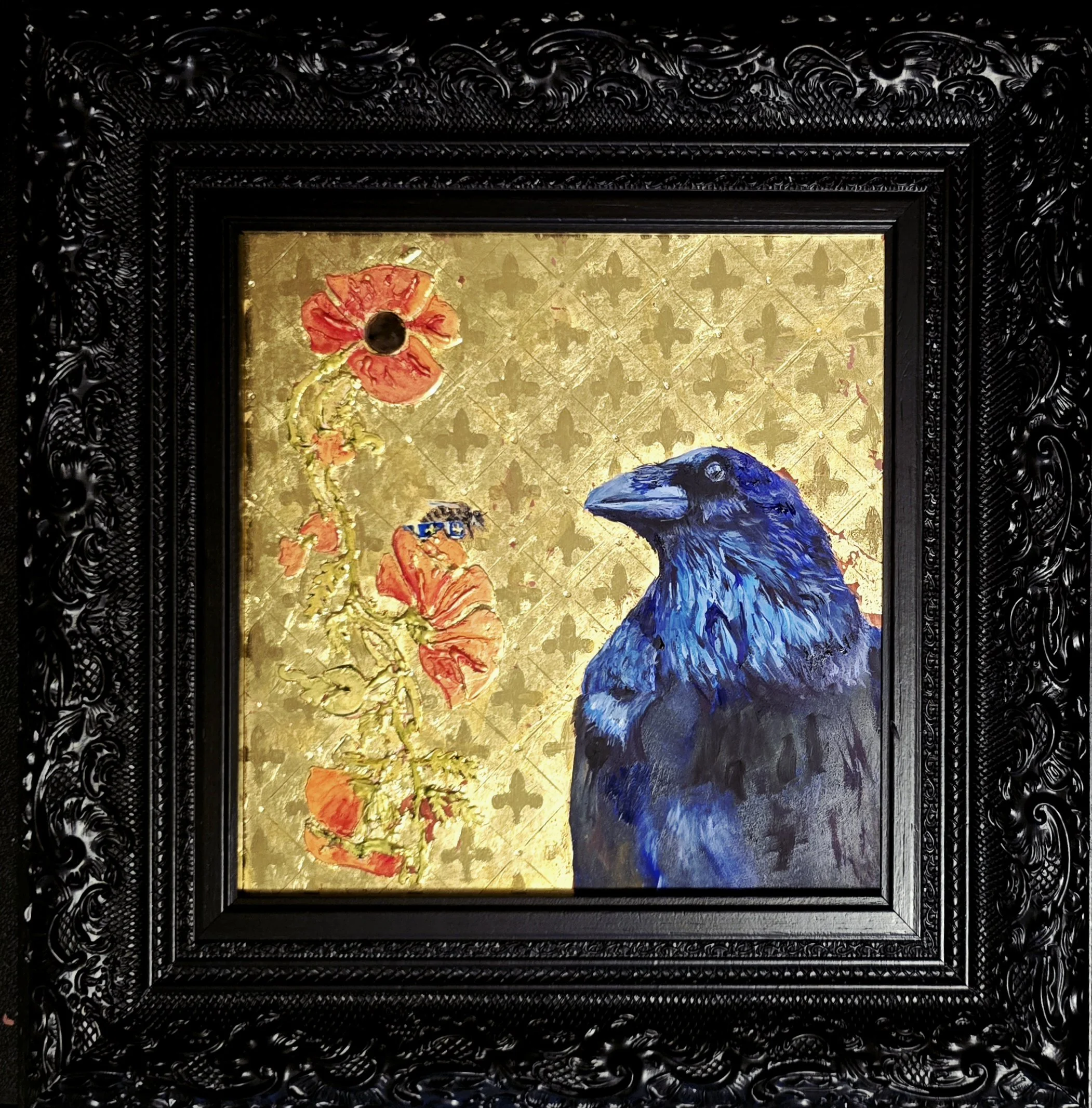 Painting of a blue raven next to a red poppy flower with a queen bee on top of fleur de lis ring on a gold background, framed with an ornate black frame.