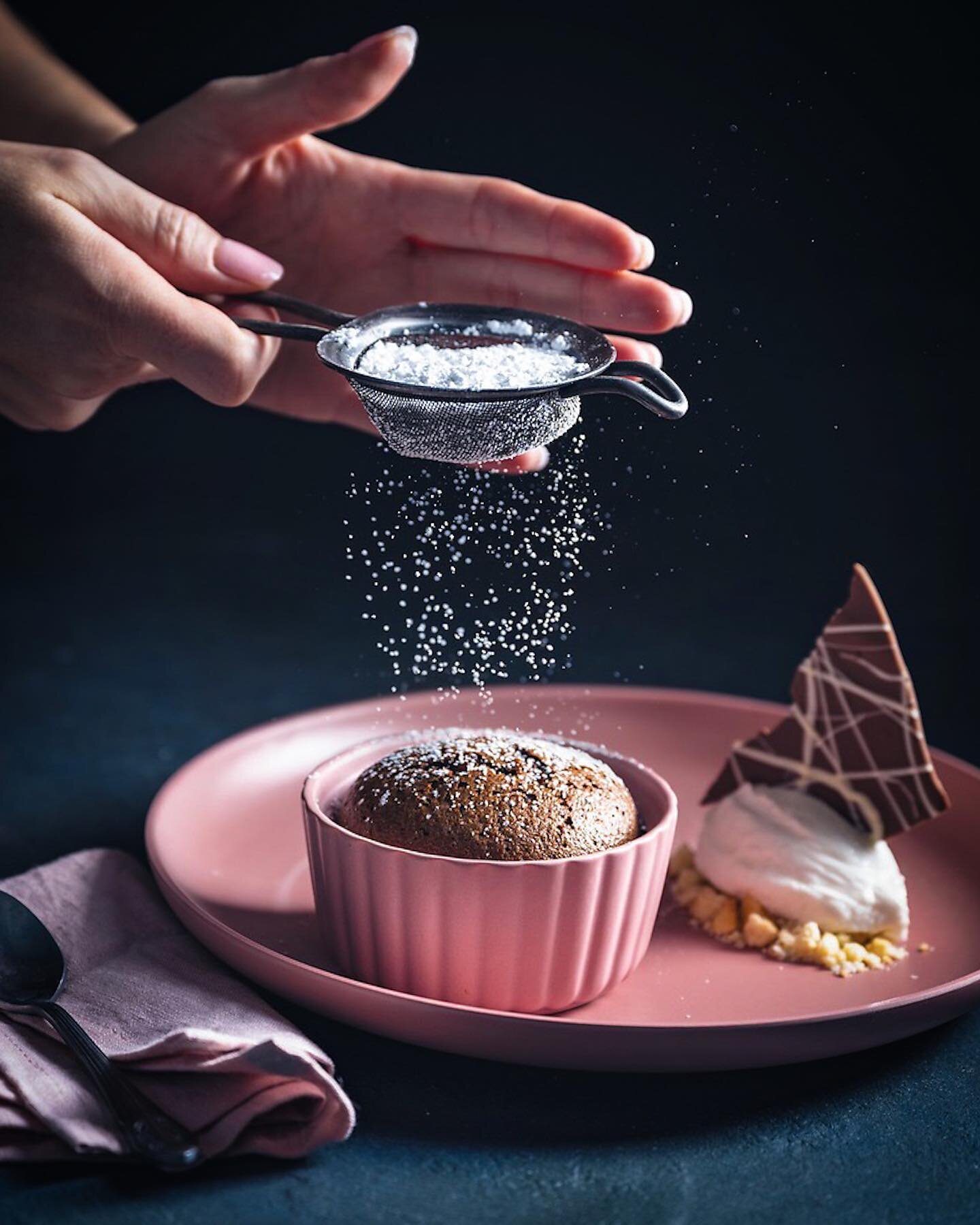 One of my favorite shots from the Crazy Sweet Creations cookbook by @howtocookthat 👩&zwj;🍳 
.
We had two versions of this dessert. One in a black ramekin and one with pink. We shot both but the sprinkling action on the black was better but the pink