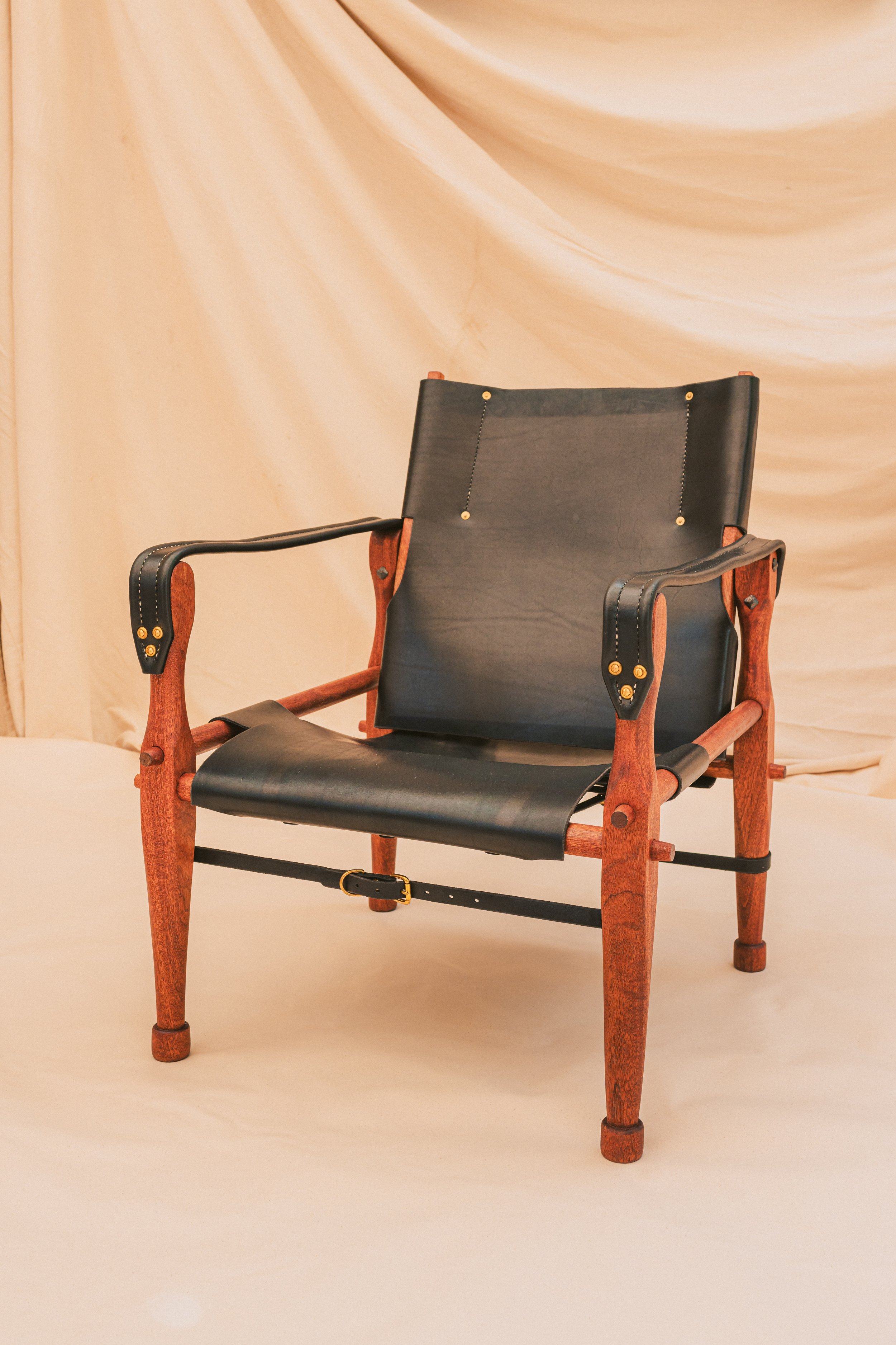 Black leather and Mahogany Roorkee chair standing handsomely. A perfect chair for an executive character