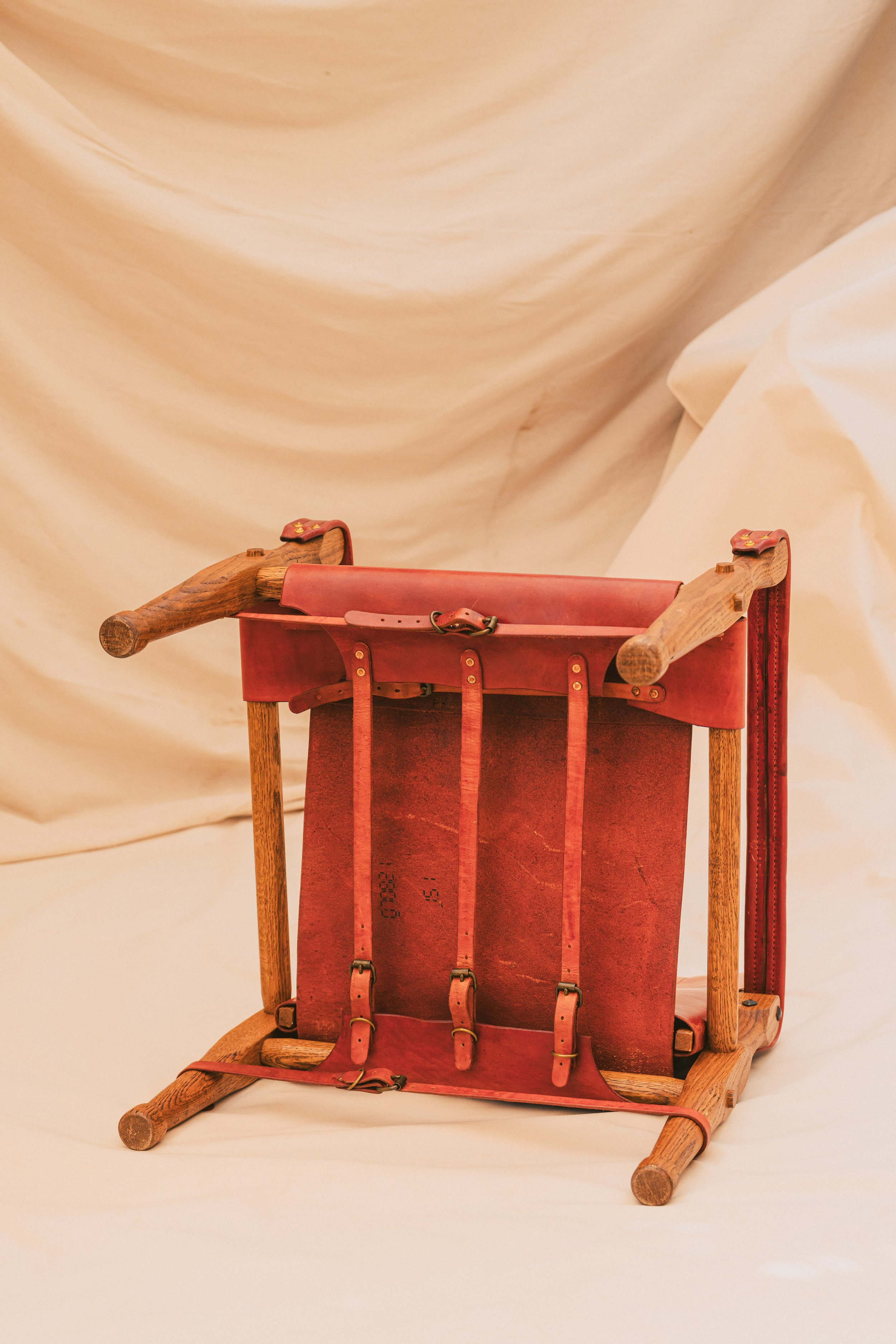 View of the Underside of the Red Brown leather Roorkee chair. Assembled with Leather Straps