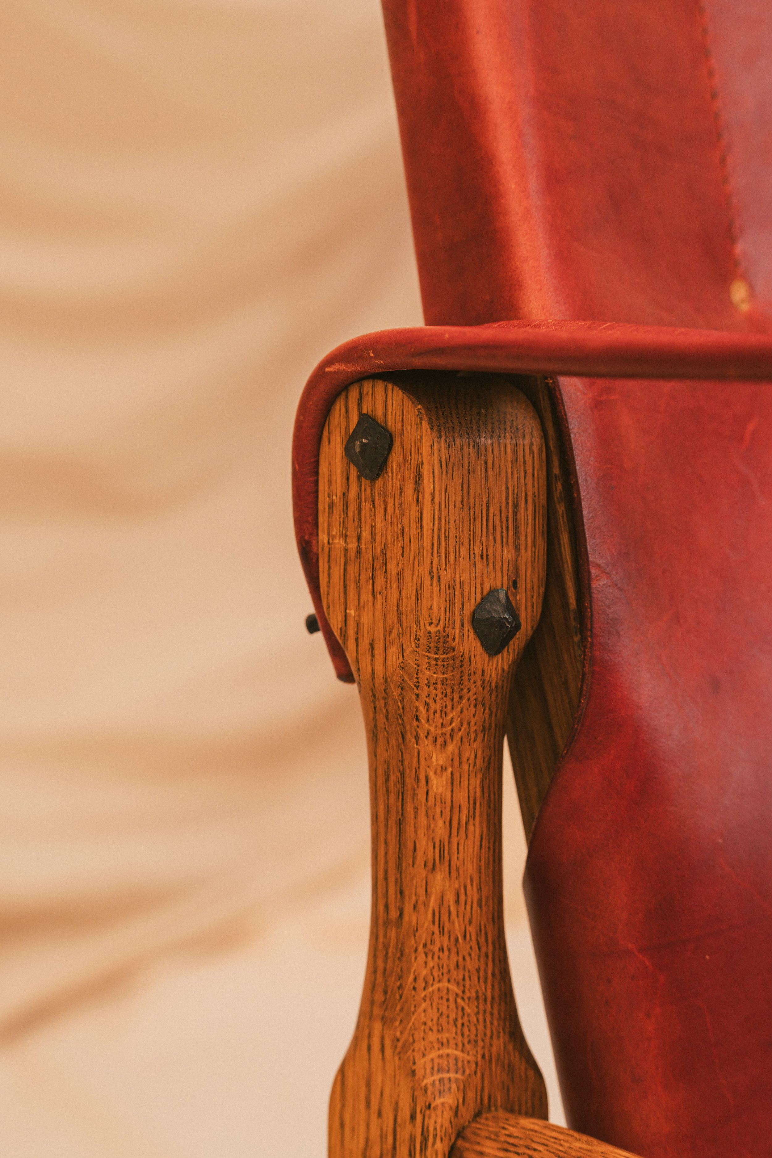 Close up view of the Hand Dressed Hammered steel hardware for the leather lounge Roorkee Chair