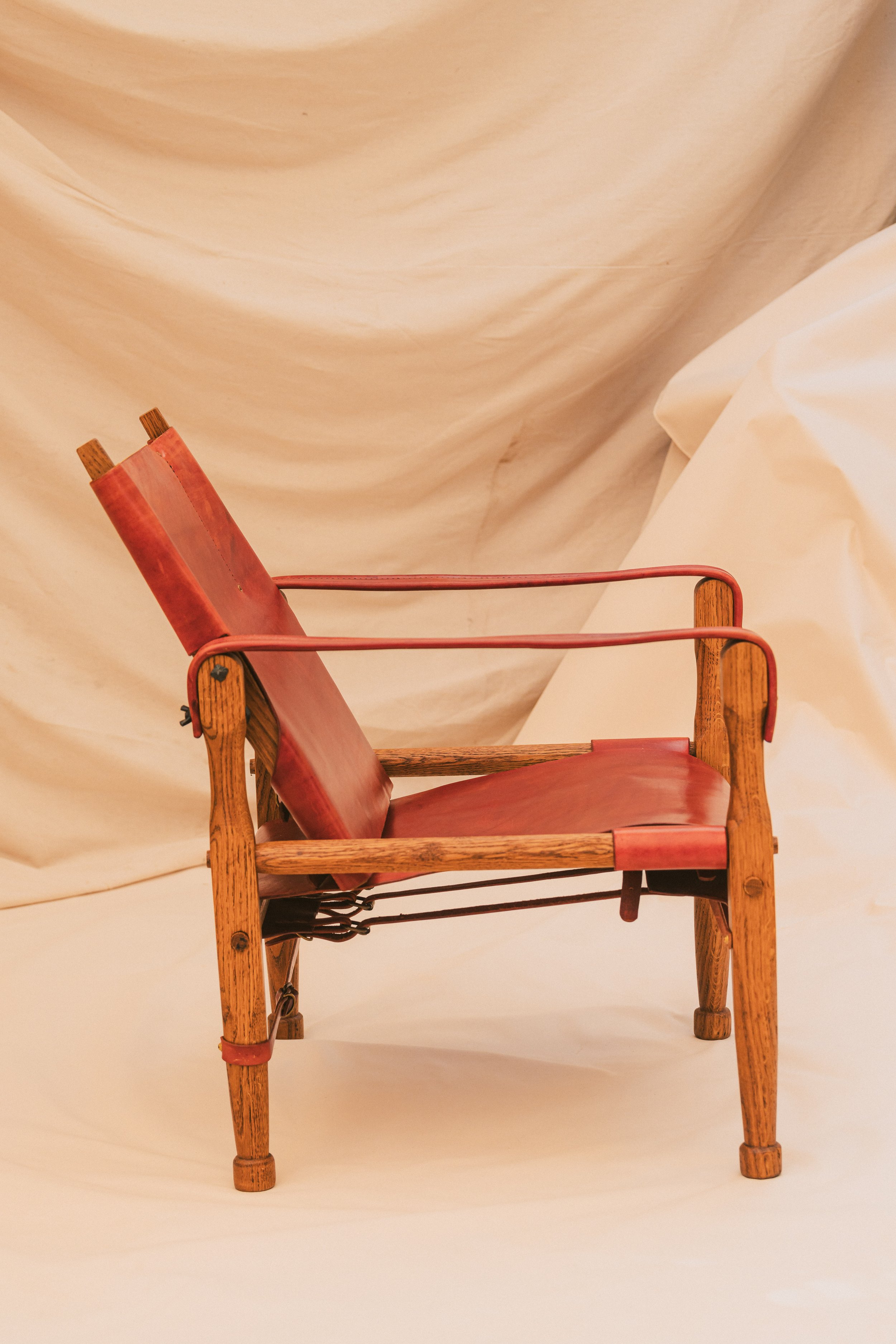 Side View of Handmade Craftsman Roorkee Chair. Turned wood legs and brass hardware