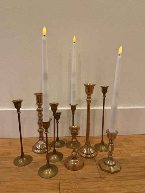 10 gold taper candle holders & 35 white battery taper candles