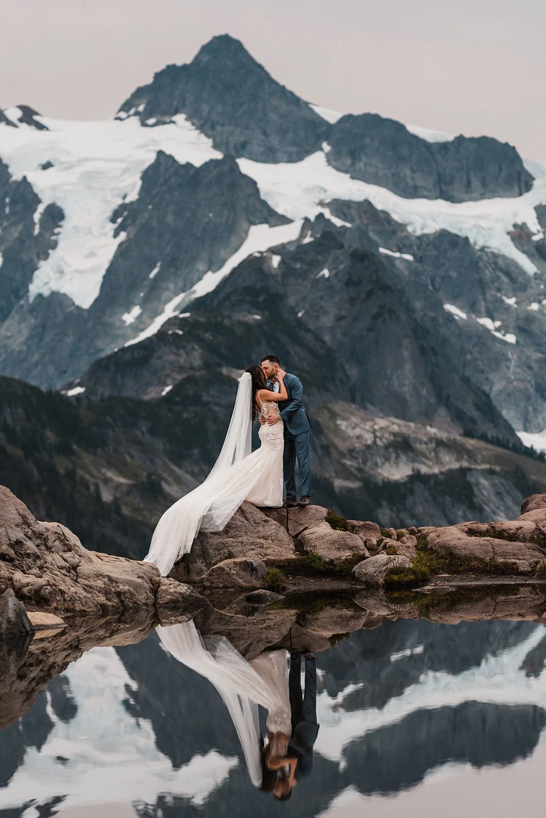 A couple at reflection lake at Mt Baker eloping in washington state