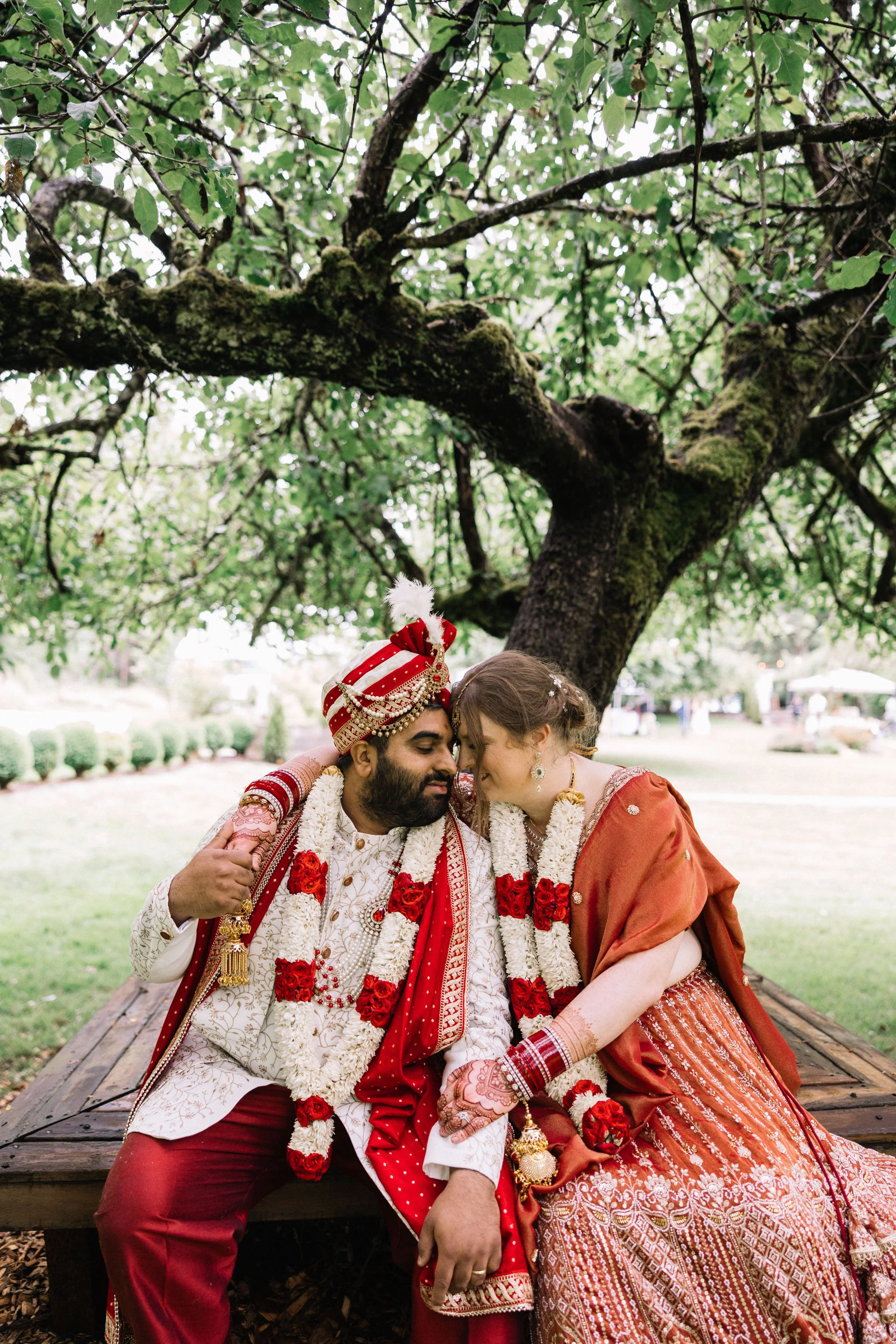 A bride and groom touching foreheads at a wedding planned with our Seattle wedding planning services