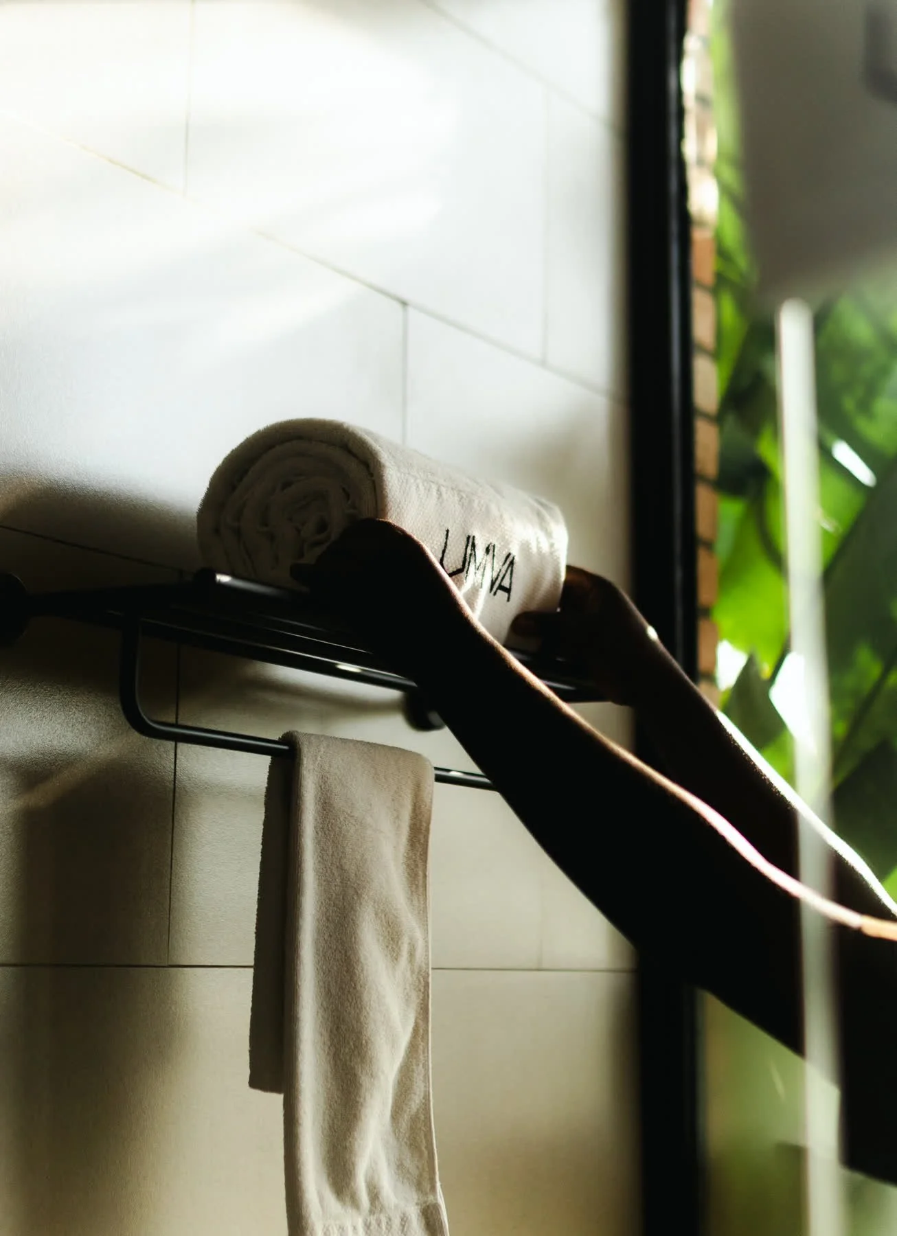 Fresh towels on a steel rail