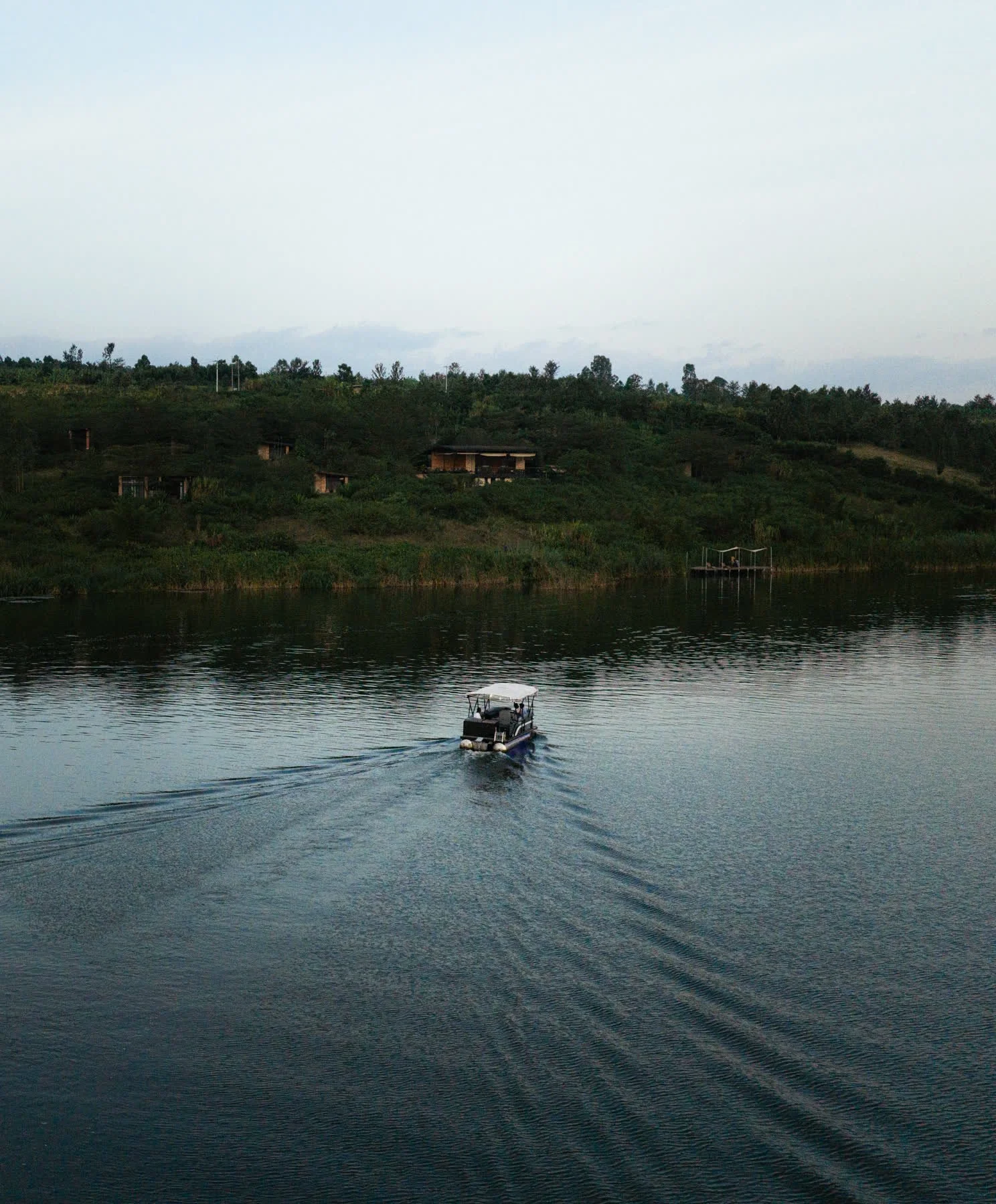 The electric boat on the lake at dusk
