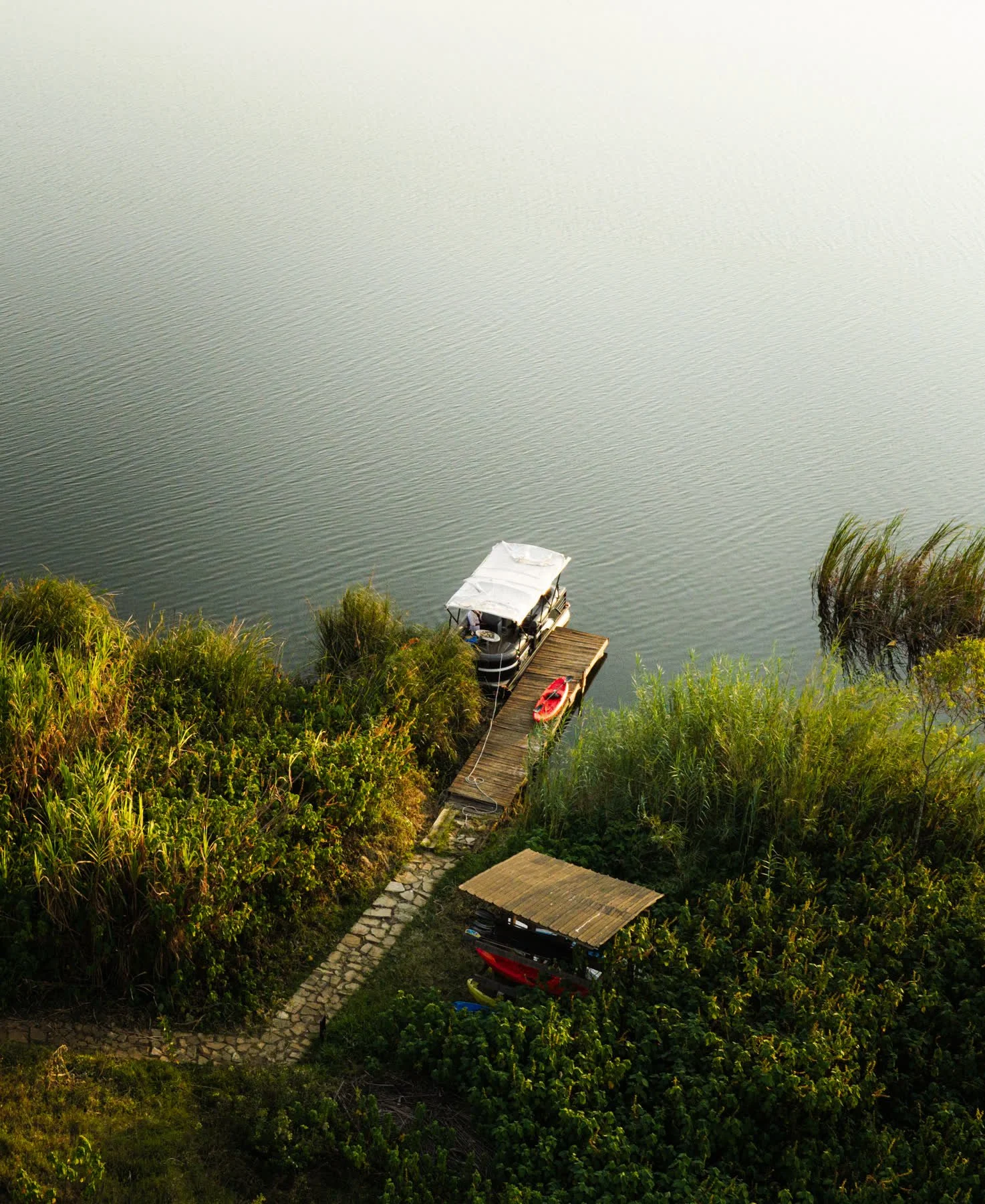 Aerial view of the dock and boathouse below the lodge