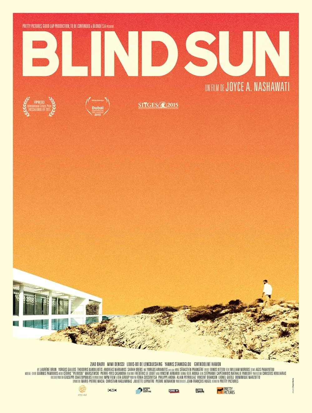Movie poster for 'Blind Sun' showing a man standing on a rocky hill against an orange gradient sky, with a modern building on the left side.