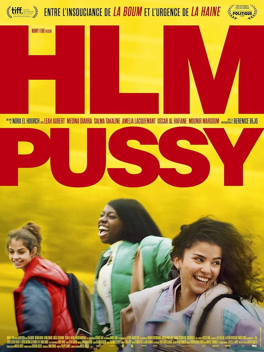 A movie poster for the film titled "Him, Pussy" features three smiling young women walking outdoors on a yellow background. The poster includes text in French, indicating the film's themes and credits.