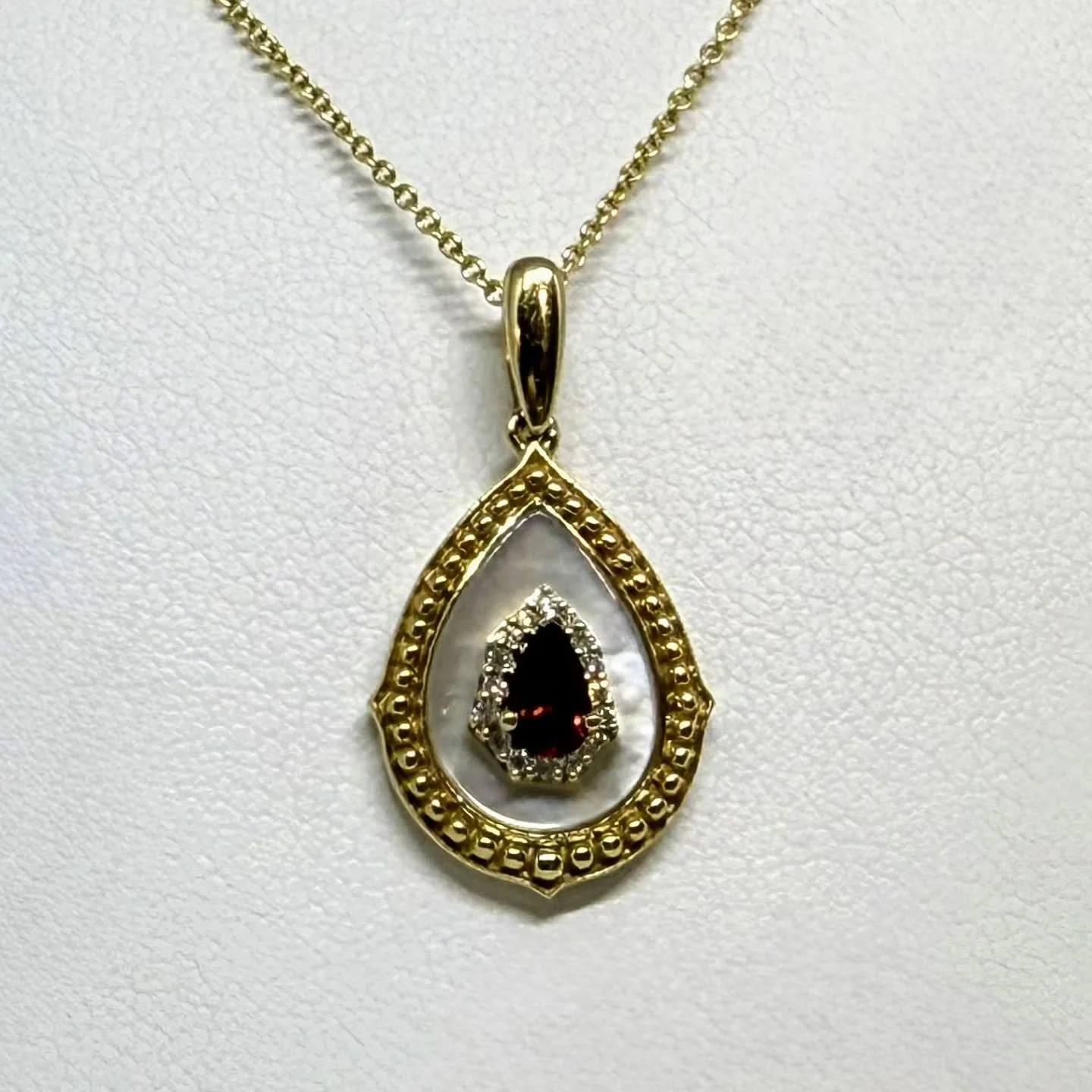 Mother of pearl and garnet.