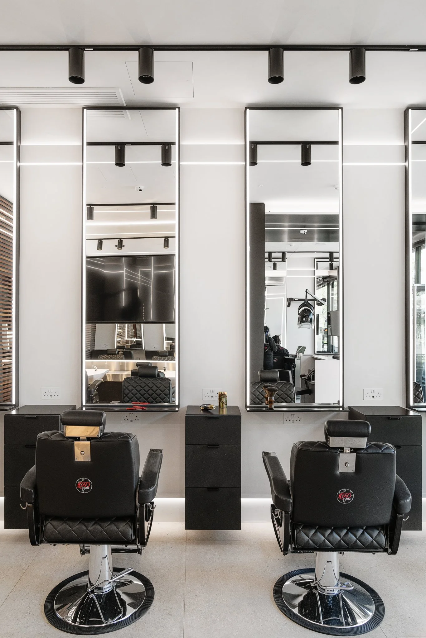 Backwash station with steel counter and walnut slatted wall