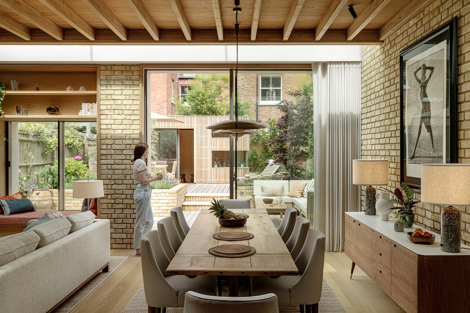 Dining area with exposed brick and artwork