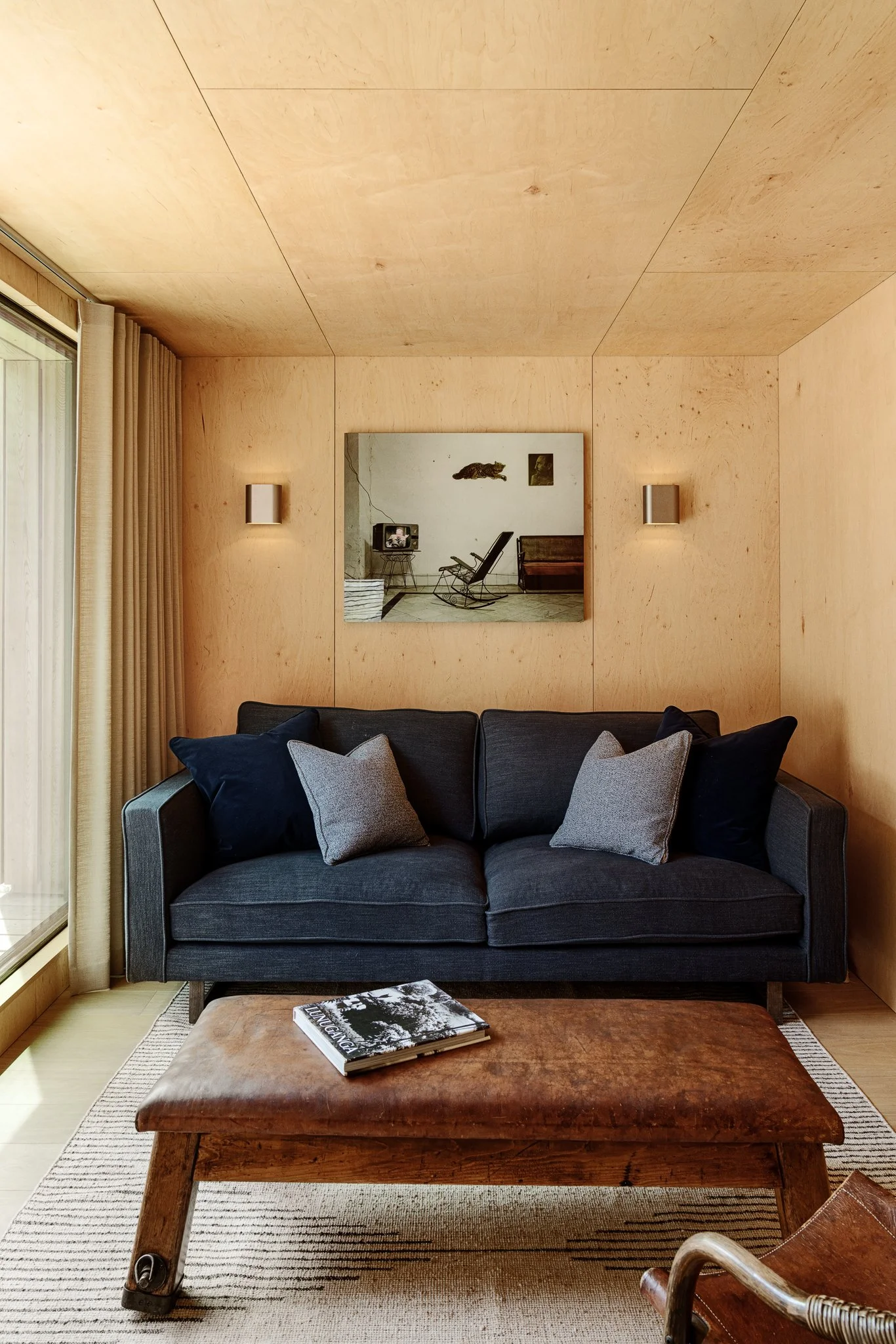 Living room with sage cabinetry