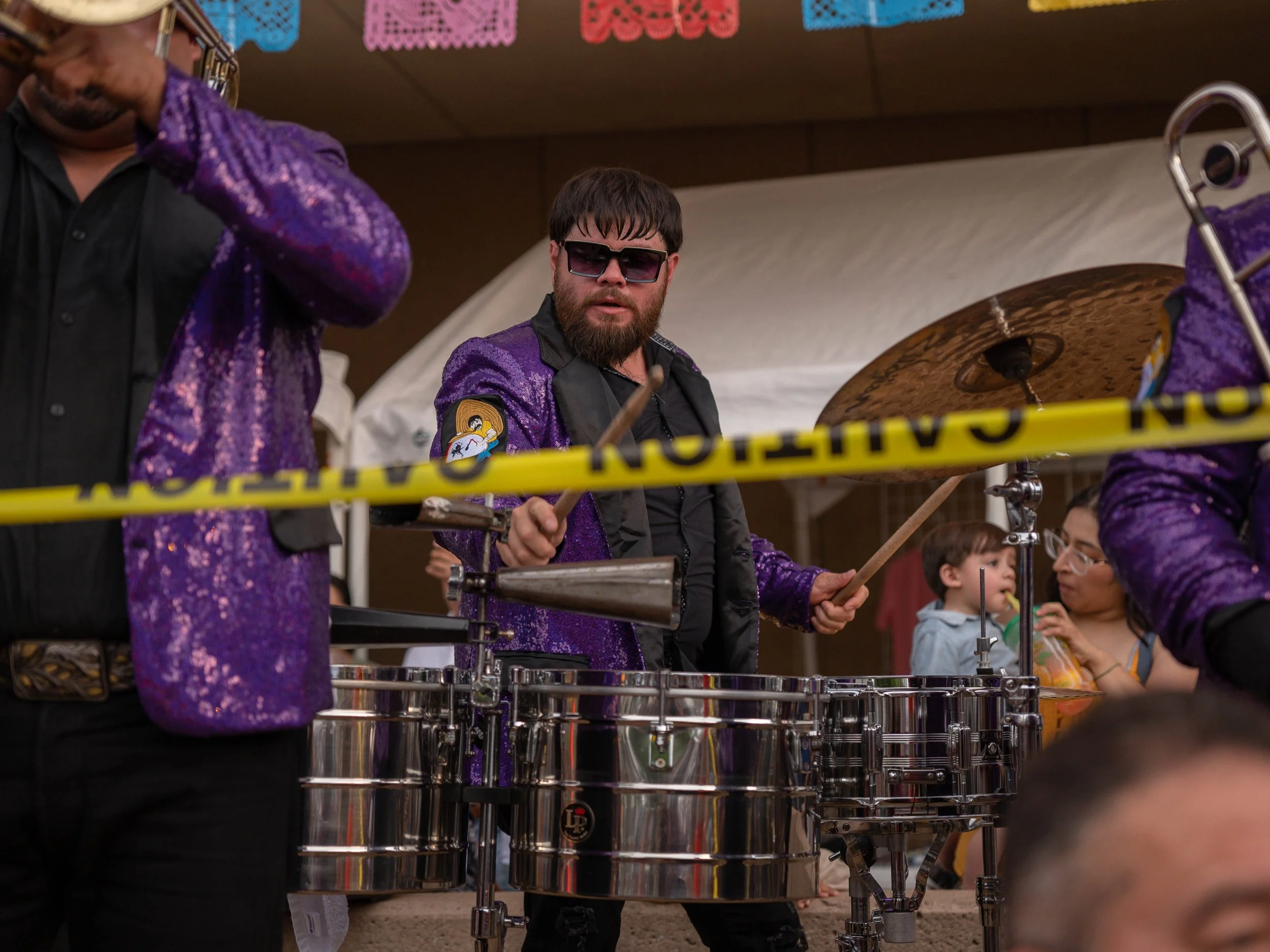 A nortena band performs at the steps of Century II in downtown Wichita, KS alongside the crowd