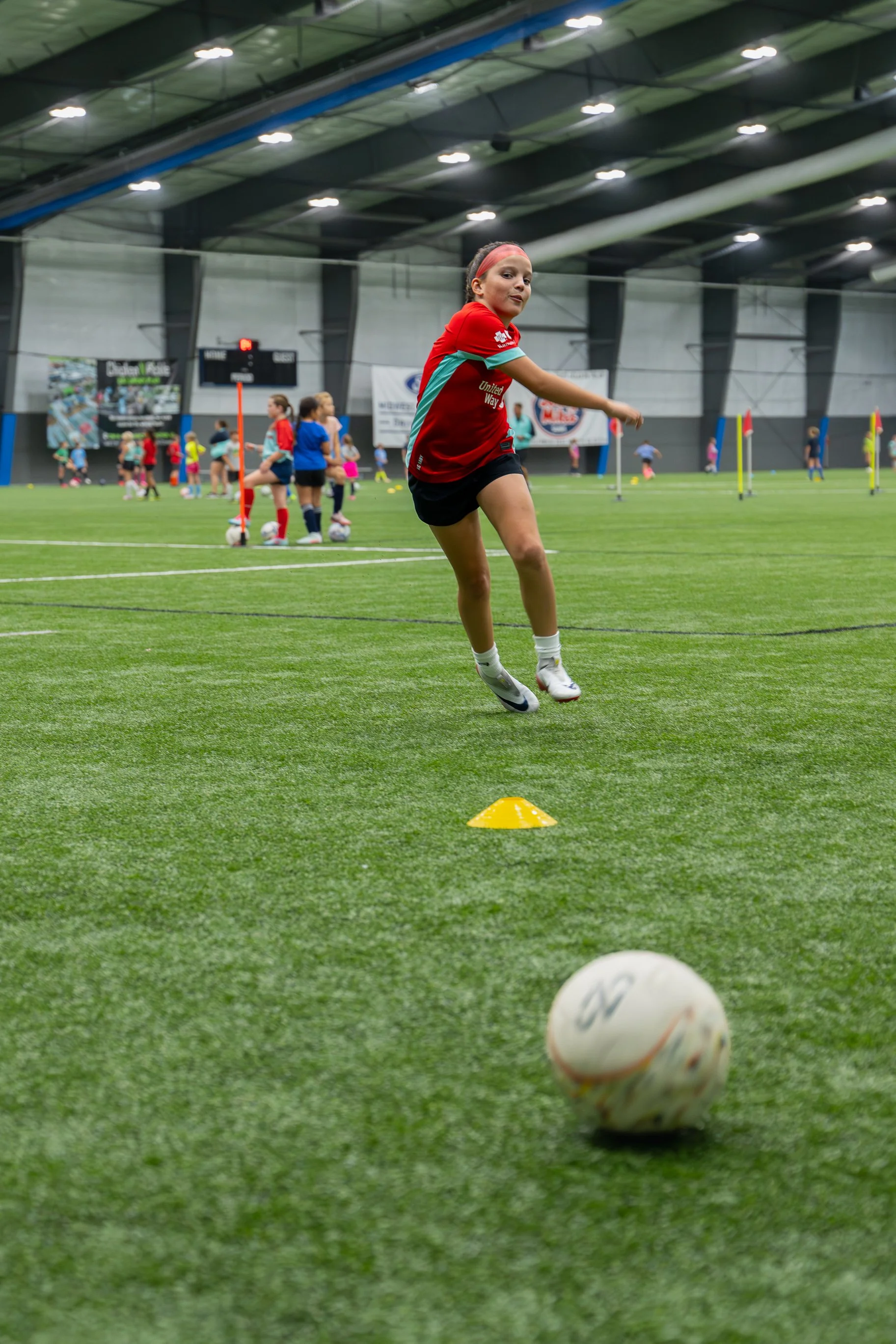 During a training facilitated by the KC Current's women's soccer team, this young player is running drills