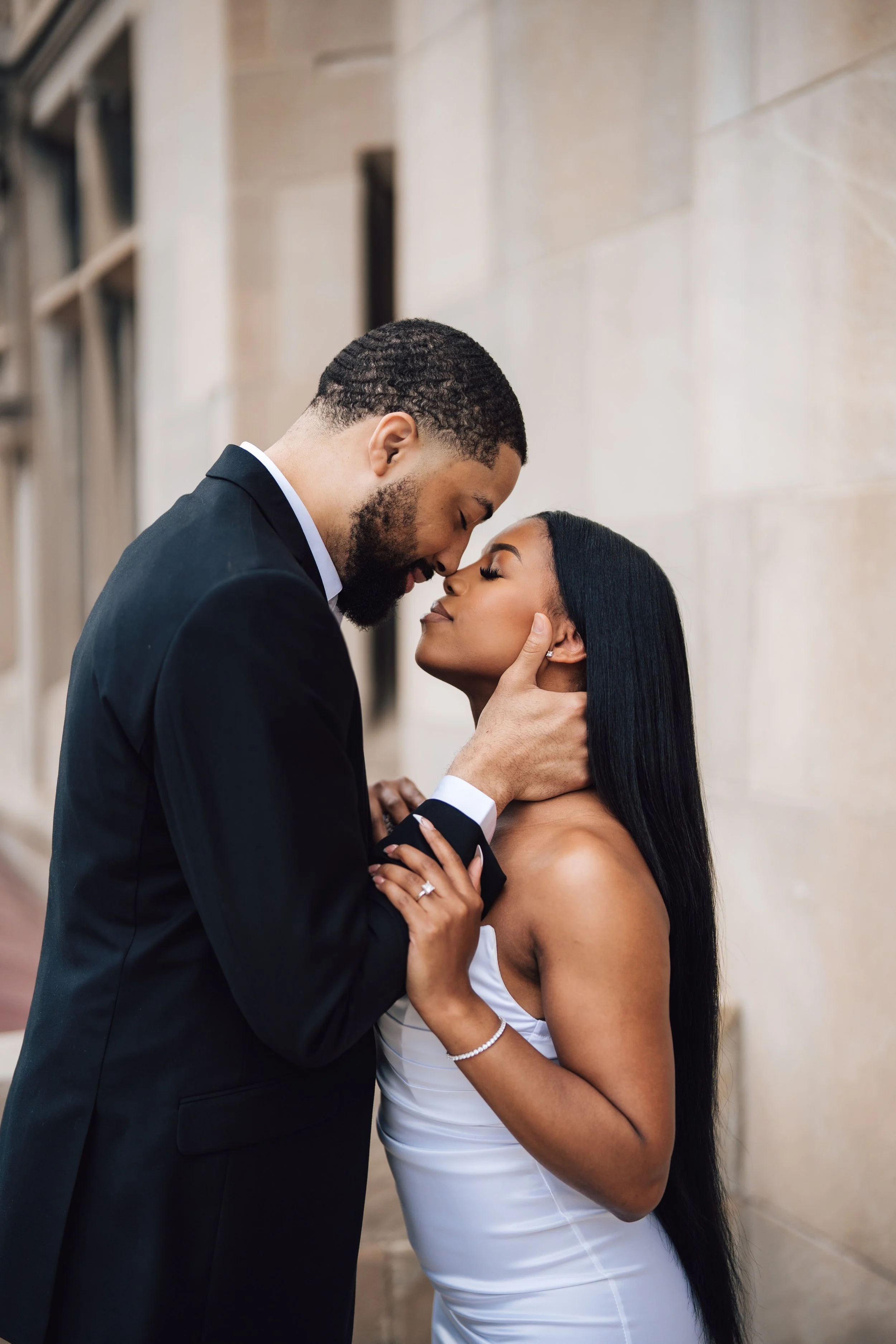 A couple sharing an intimate moment, emphasizing their faces and expressions.
