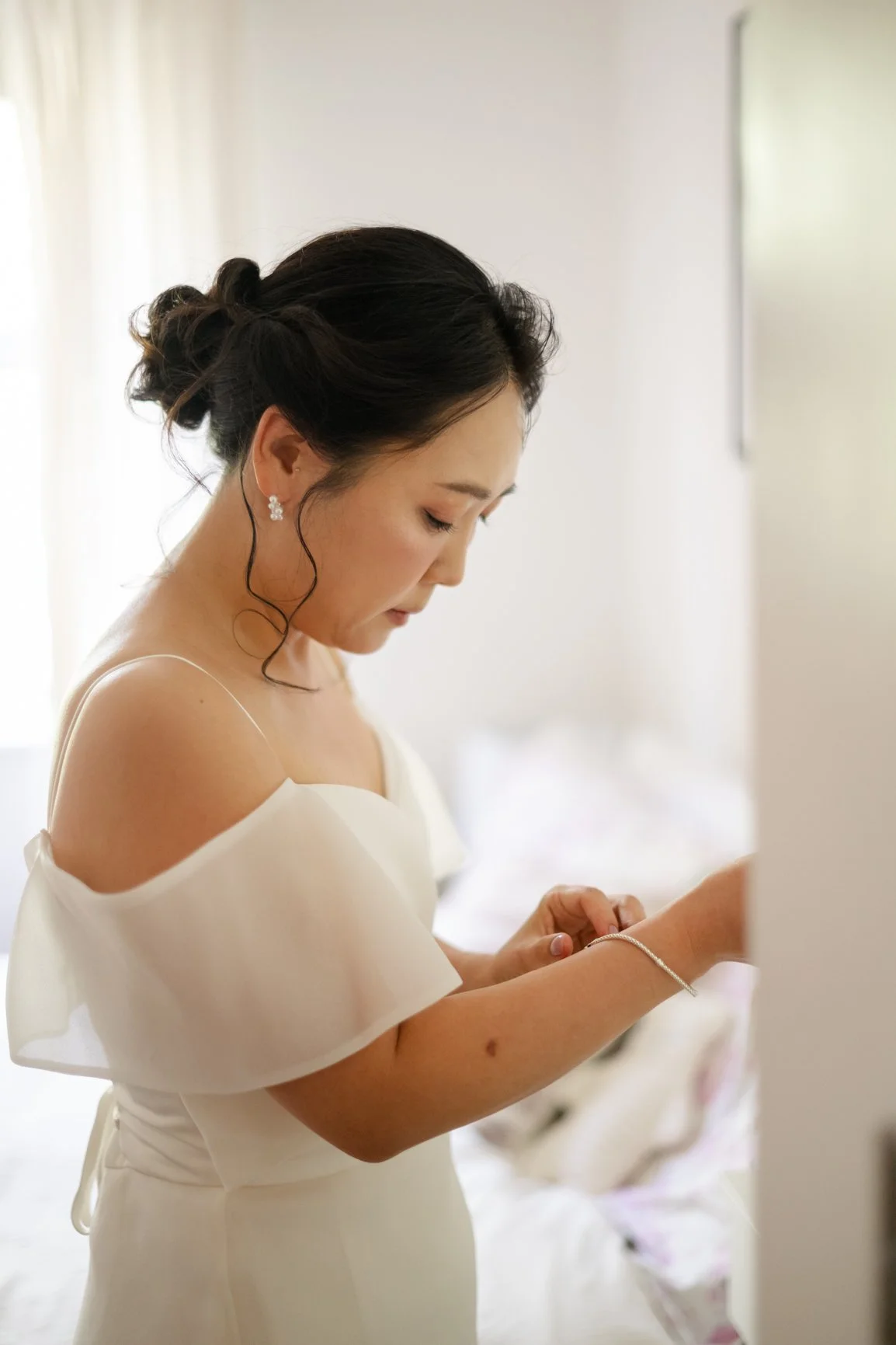 Bride getting ready for an intimate wedding in Wokingham