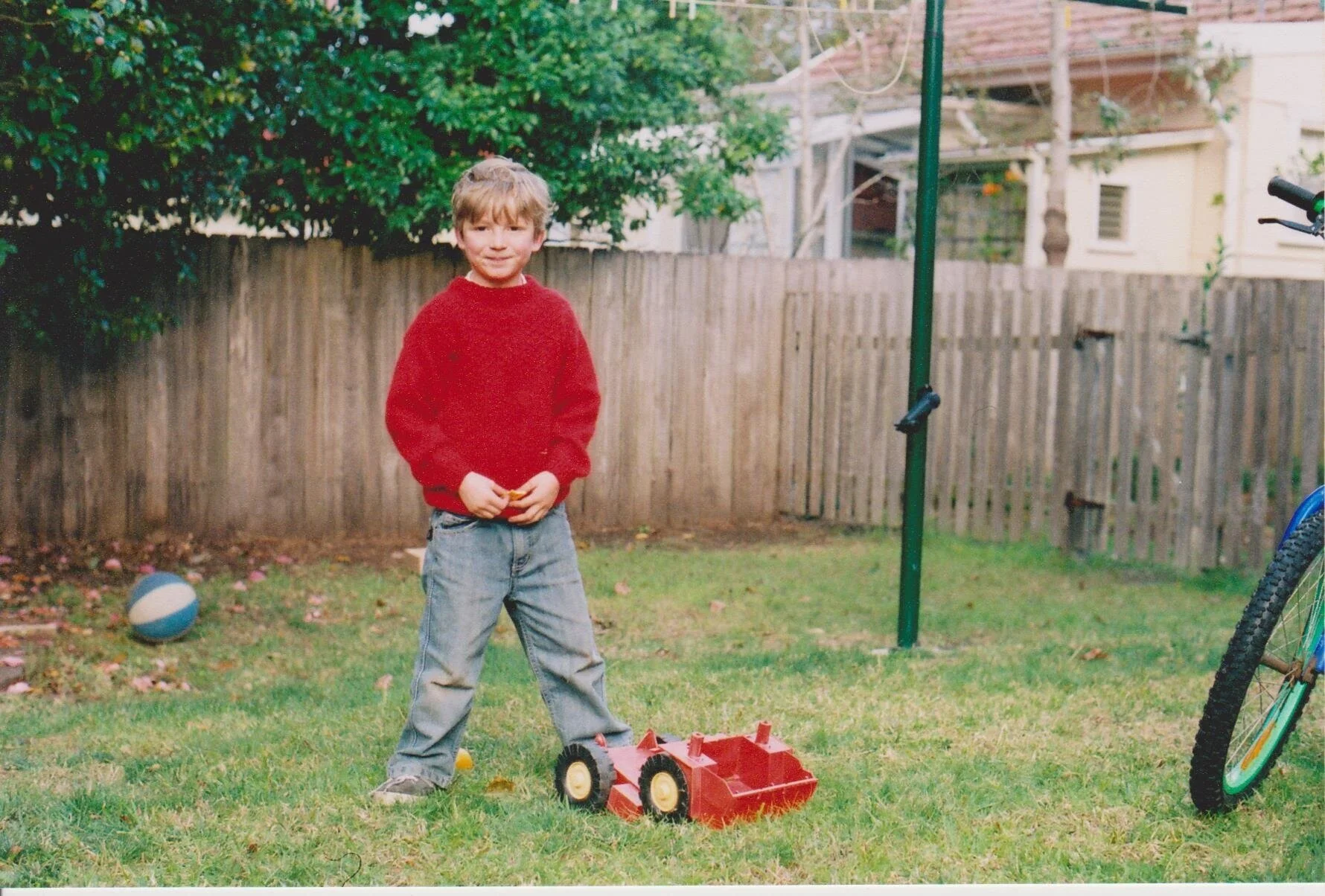 In the back yard at three years old