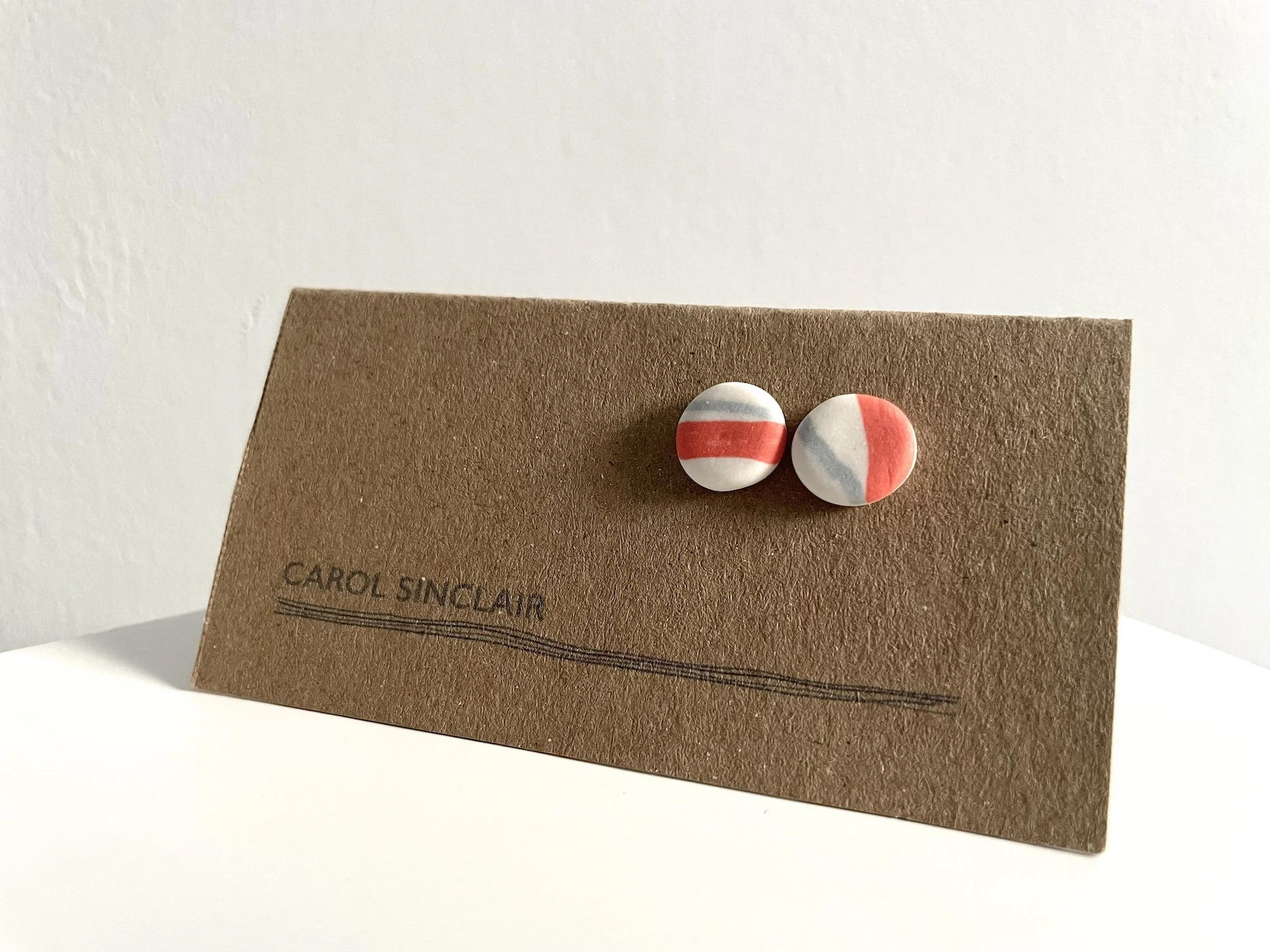Haym Porcelain Earrings white:grey and orange.jpg