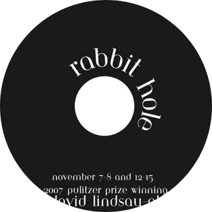 Black circular object with white text advertising the Rabbit Hole event, November 7-8, 2007, related to David Lidosau.
