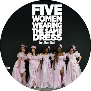 Five women dressed in similar pink dresses standing in a line on stage for a performance.