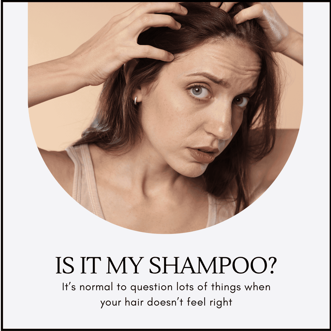 Here is an image of a woman looking very worried that her hair is thinning