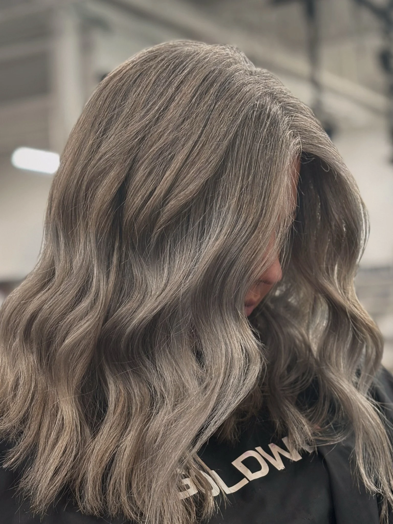 want the real timeline for gray blending hair color services? bLUXE maps it out for you. Here is an image of a beautifully gray blended blonde client with Goldwell Color