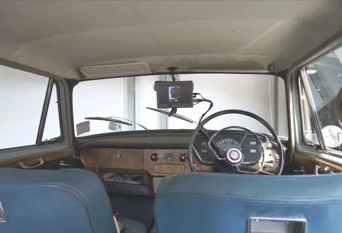 Installation view - inside the car, with the film playing on a small screen 