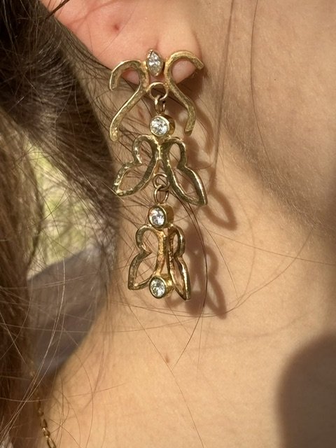 wing earrings on joey.jpeg