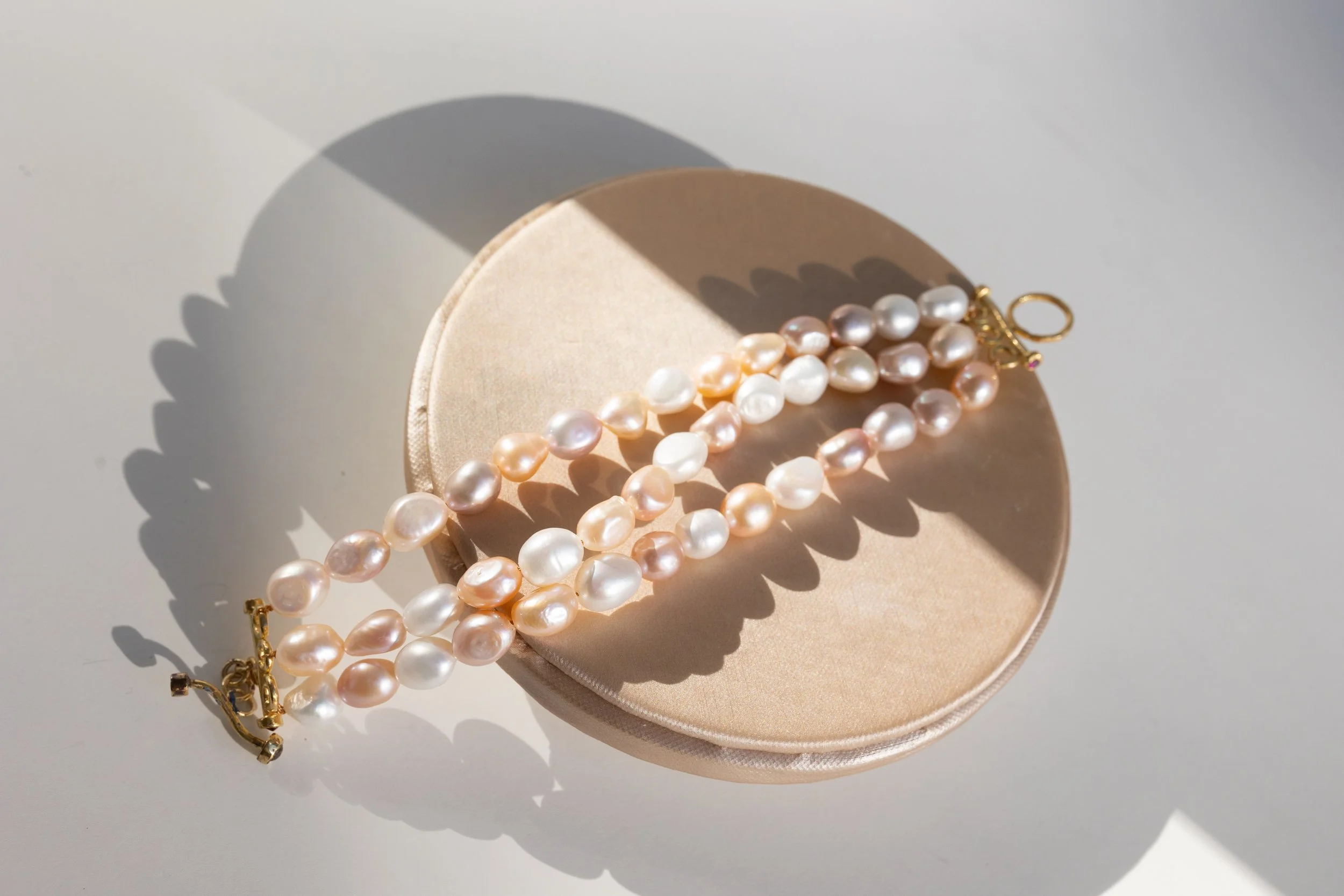 3 strand pearl bracelet.jpeg