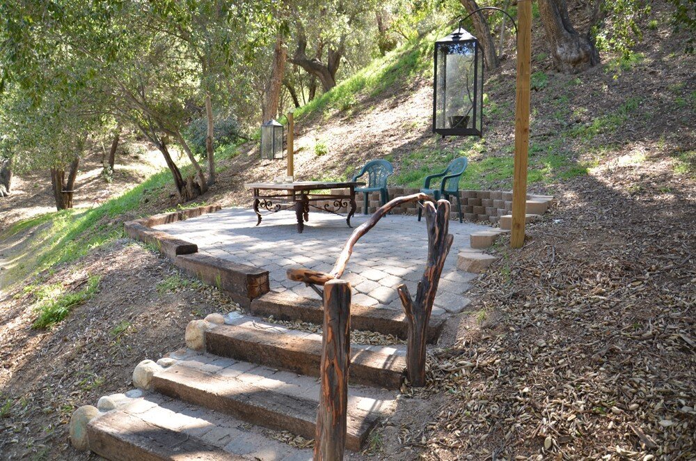 Seating area in the woods under the trees for cast and crew