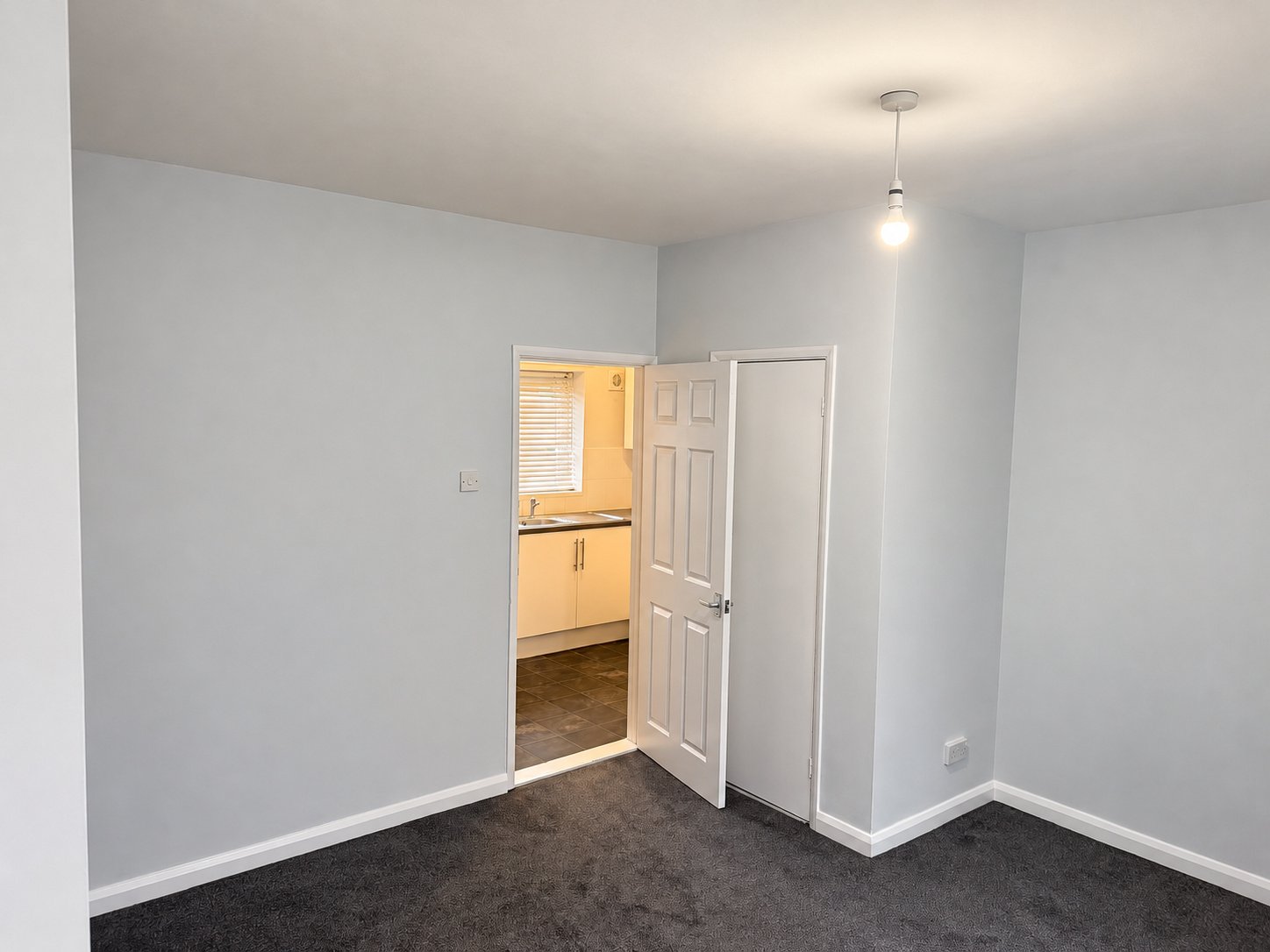 13_Living_Room_Kitchen_View_Enhanced.jpg