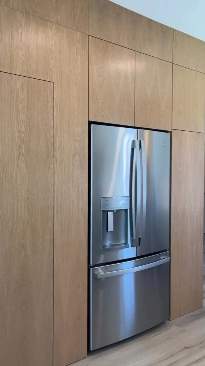 A hidden coffee bar meets appliance garage, seamlessly tucked into this custom white oak pantry wall. One of several storage solutions designed to keep the kitchen calm, clean, and highly functional.
#coastalstylehome #sweetboyhomes #interiordesign