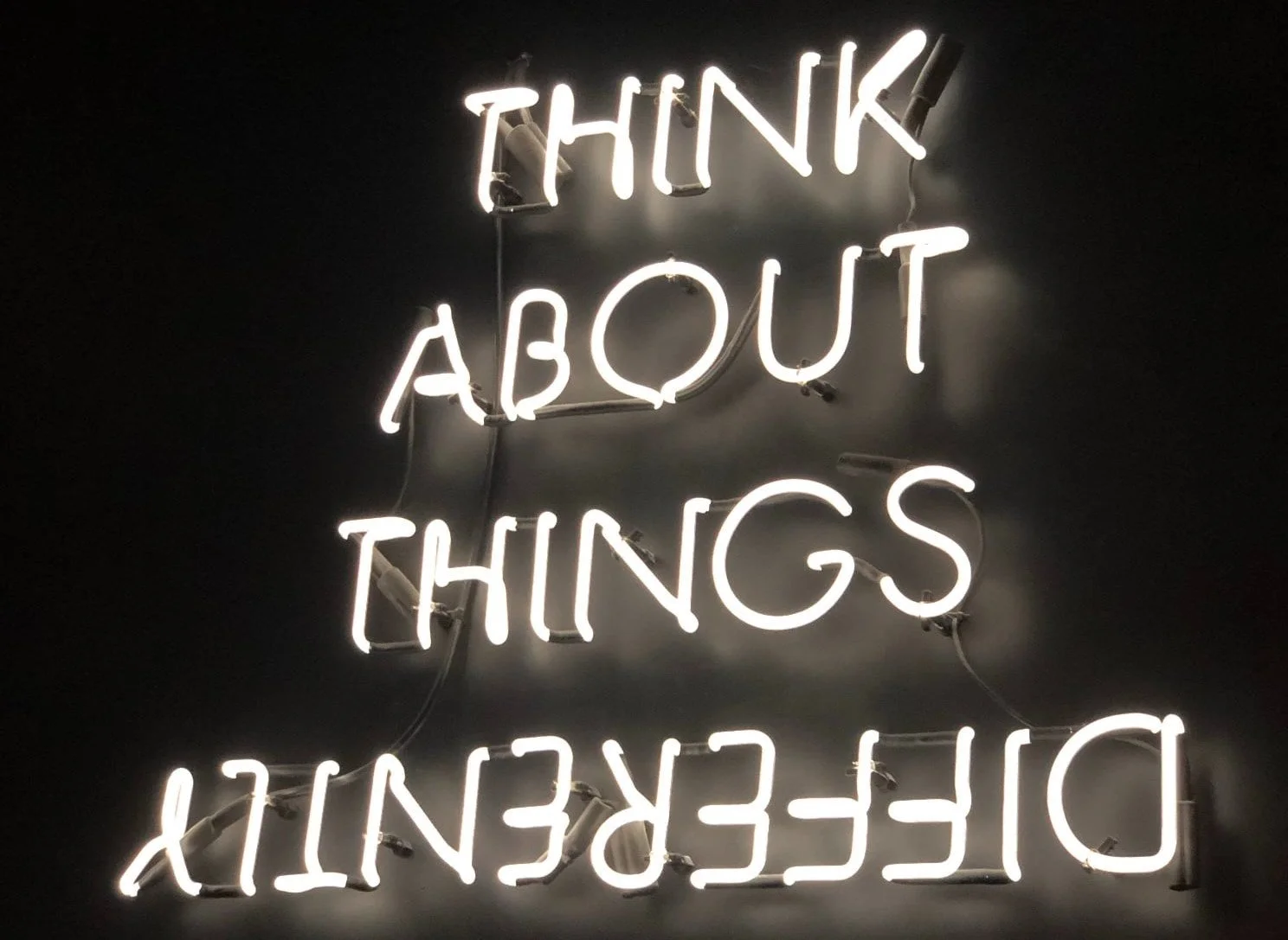 Lighted sign that says 'think about things differently'