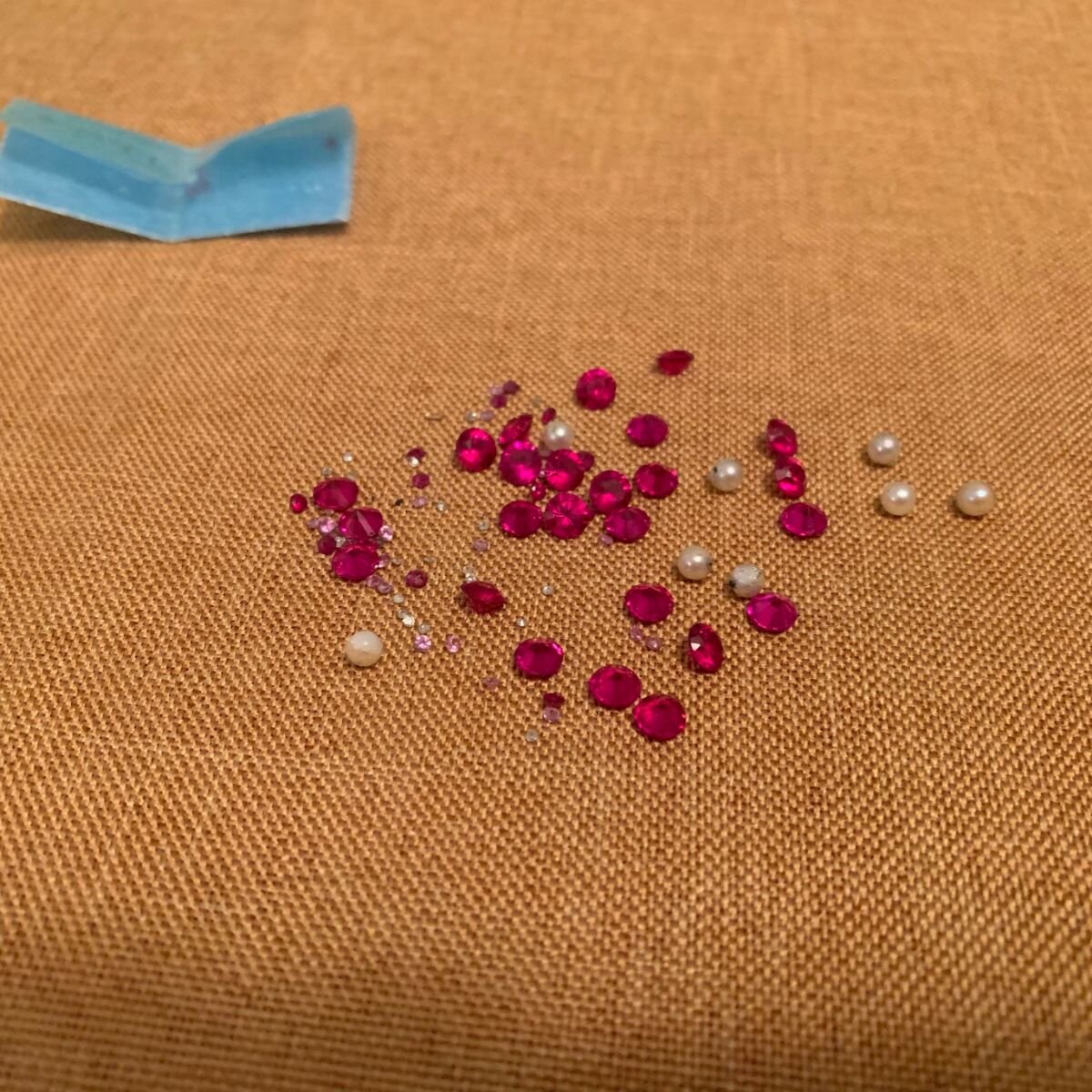Rubies, Diamonds, and Sapphires laid out for custom signet ring by JBJewels.jpeg