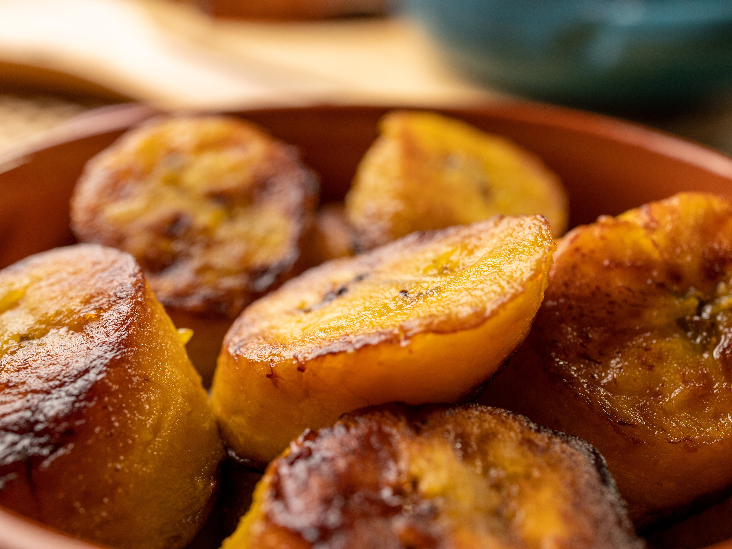 close-up of fried plantains in a wooden bowl