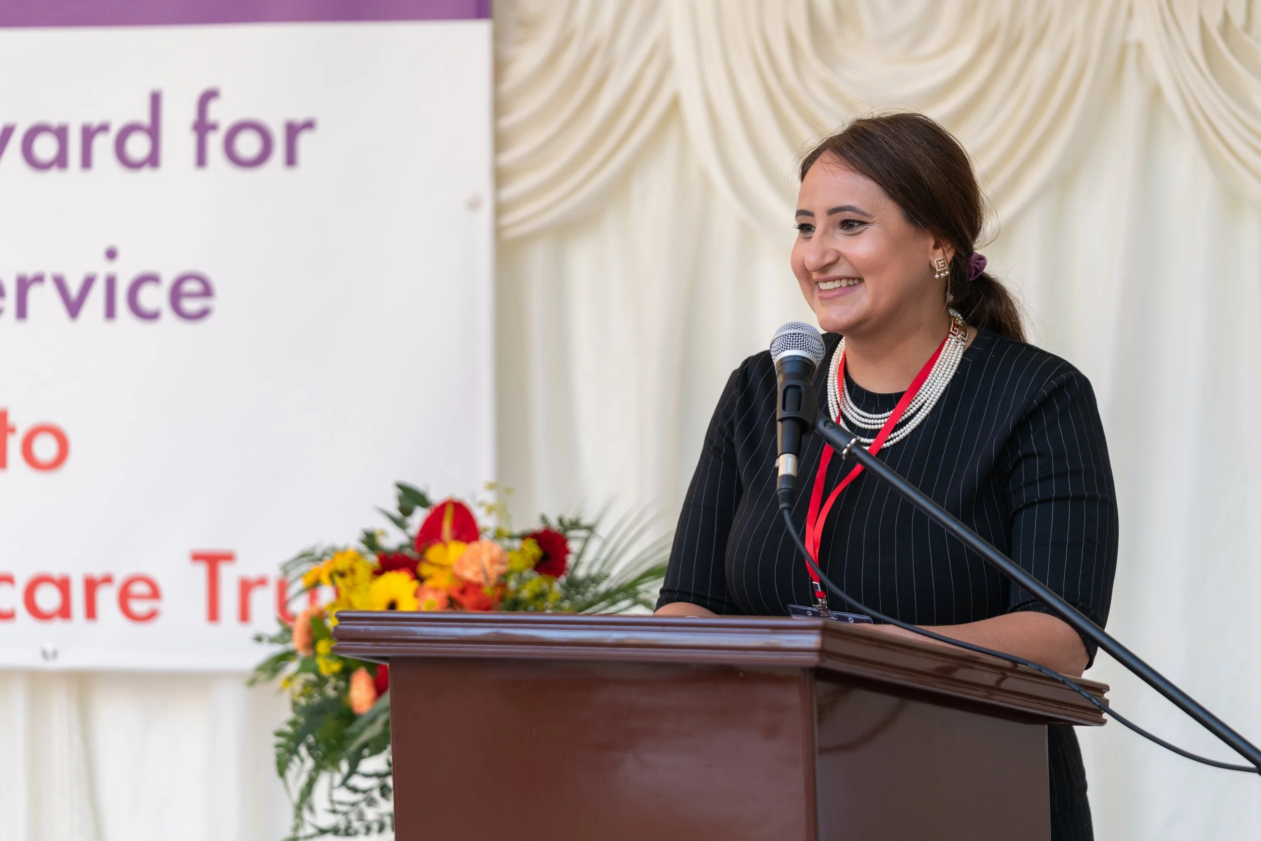 Dr Manvir Kaur Kalirai welcoming guests at start of event