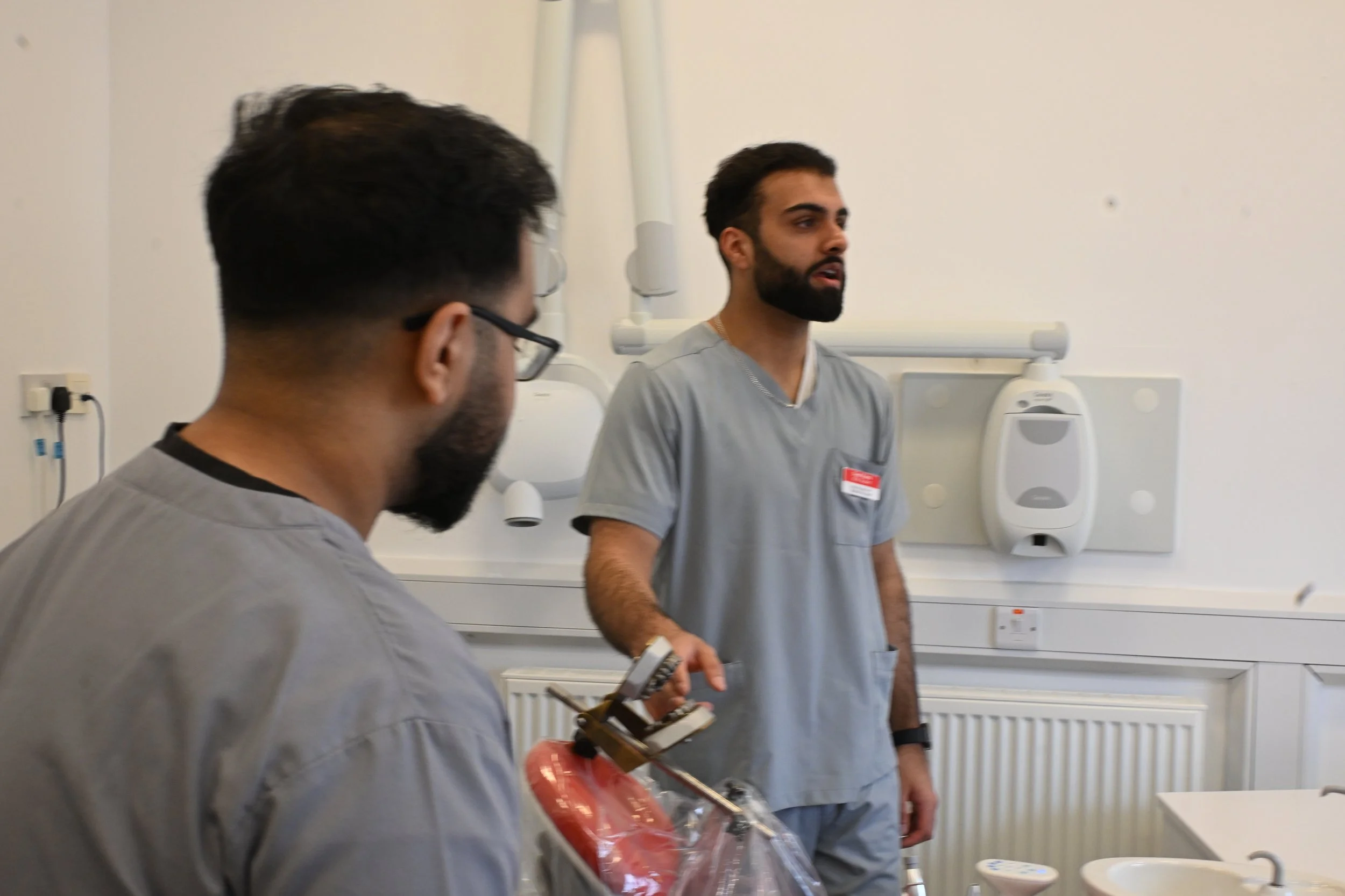 University of Birmingham dental students, supervised by Dr Sukhvinder Singh Atthi, undertaking a workshop