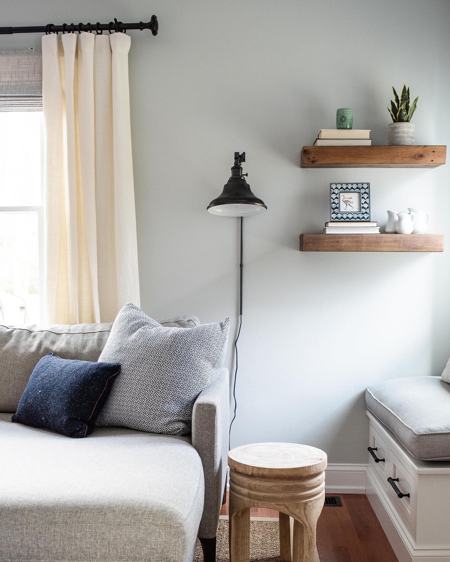 Wall sconces are both functional and eye candy. We needed task lighting in this corner, but had little space for a table and lamp. This sconce does just the trick and helps to create a cozy personalized corner for the client! 
📷 by @heatherscurran 
