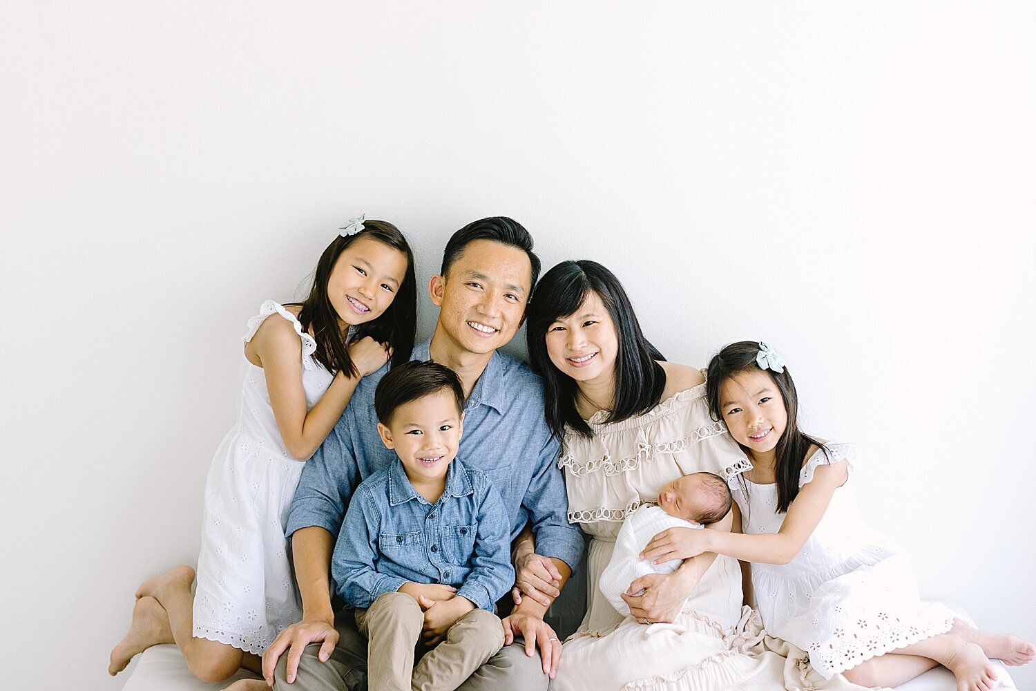 Family portrait during baby boy newborn photos with Ambre Williams Photography.